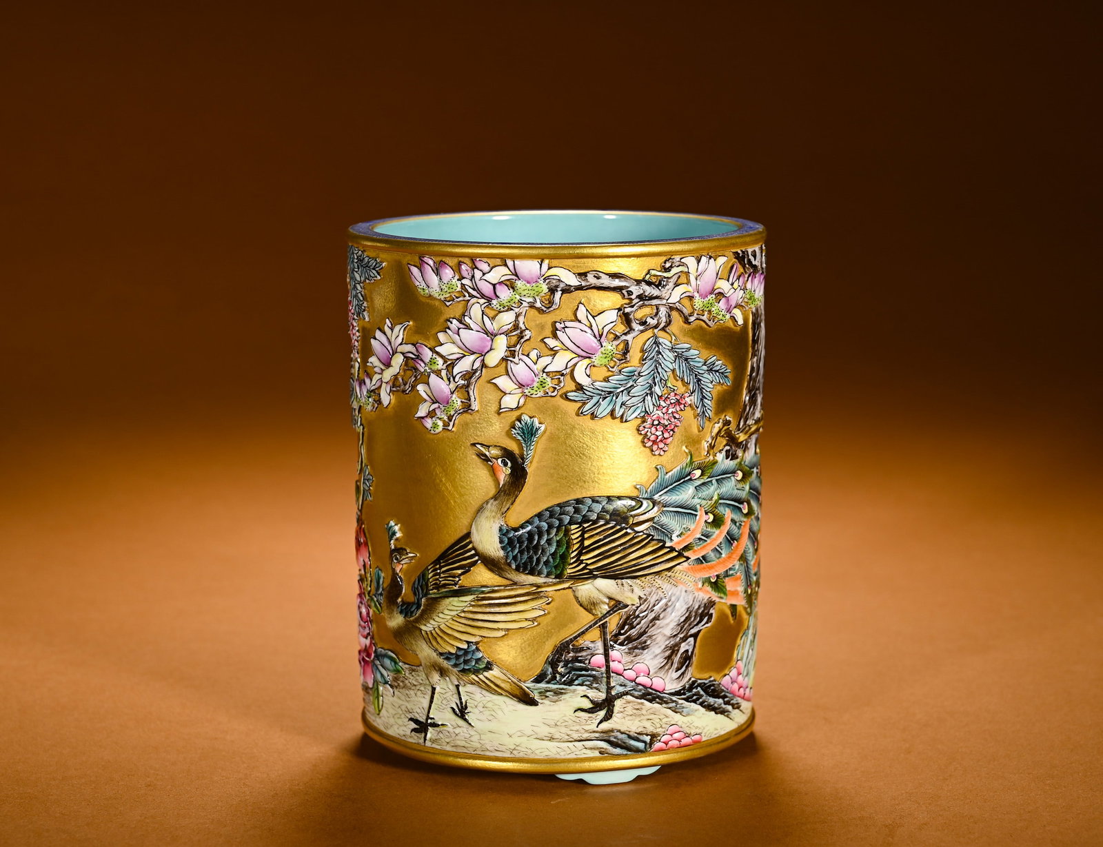 A GILDED GROUND RELIEF PEN HOLDER WITH PEACOCK AND MAGNOLIA PATTERNS (1 of 9)