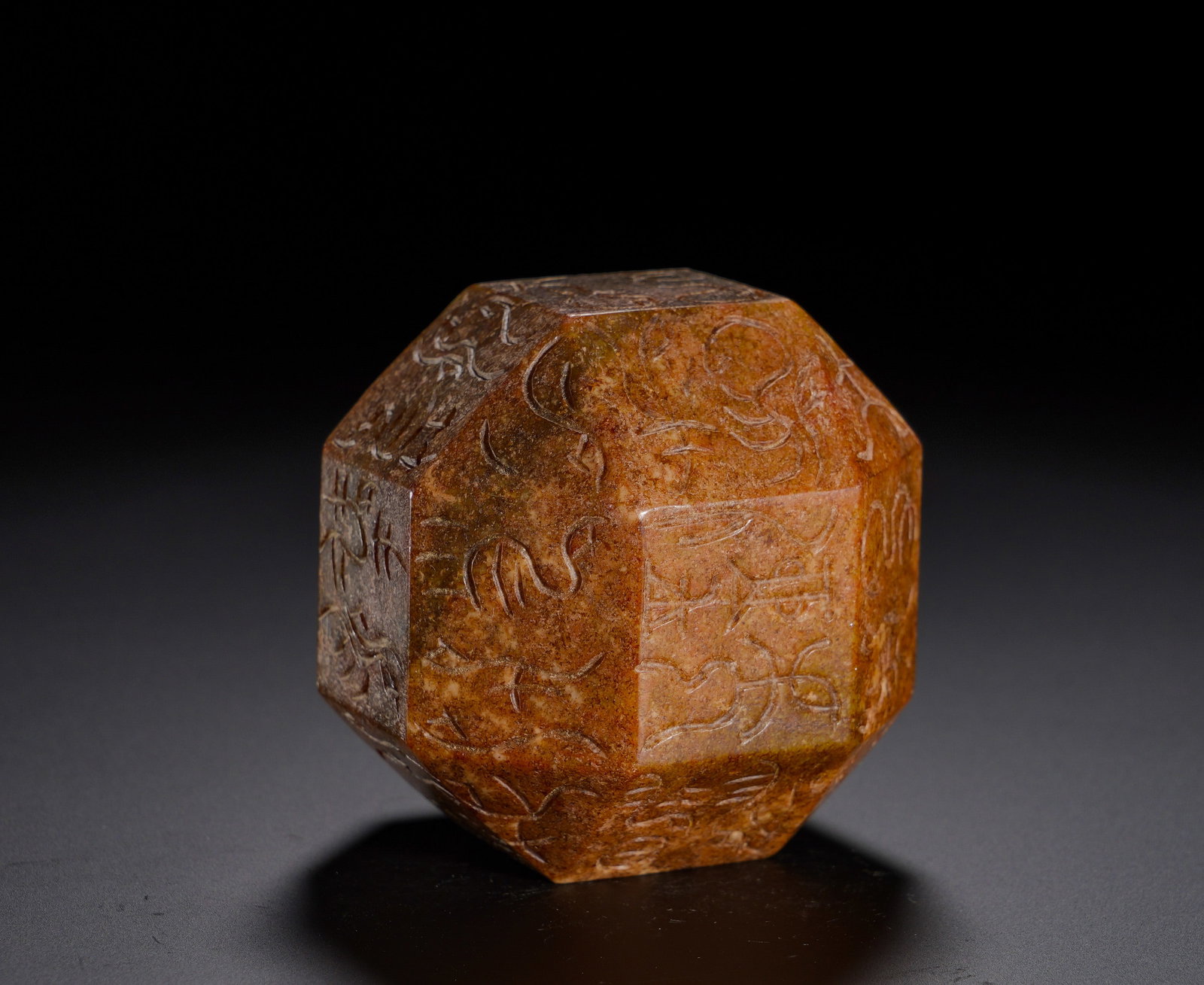 HAN DYNASTY MULTI-FACETED BIRD AND INSECT SEAL JADE SEAL: Height:5.9cm(2.32in) Width:5.9cm(2.32in) Weight:410g(0.90lb)Carved from ancient Hetian jade. Elegant bird-worm seal characters are incised on each facet. The jade is covered by layered russet patina. 