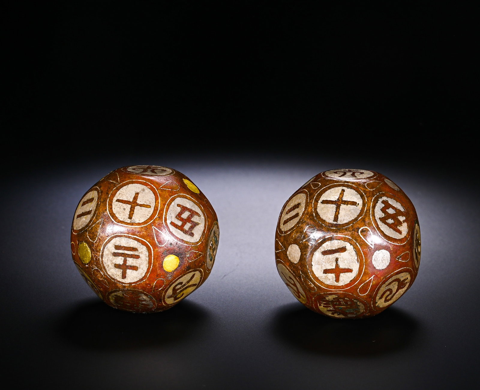 A PAIR OF COPPER INLAID GOLD AND SILVER TWELVE-SIDED DICE FROM THE HAN DYNASTY (1 of 9)