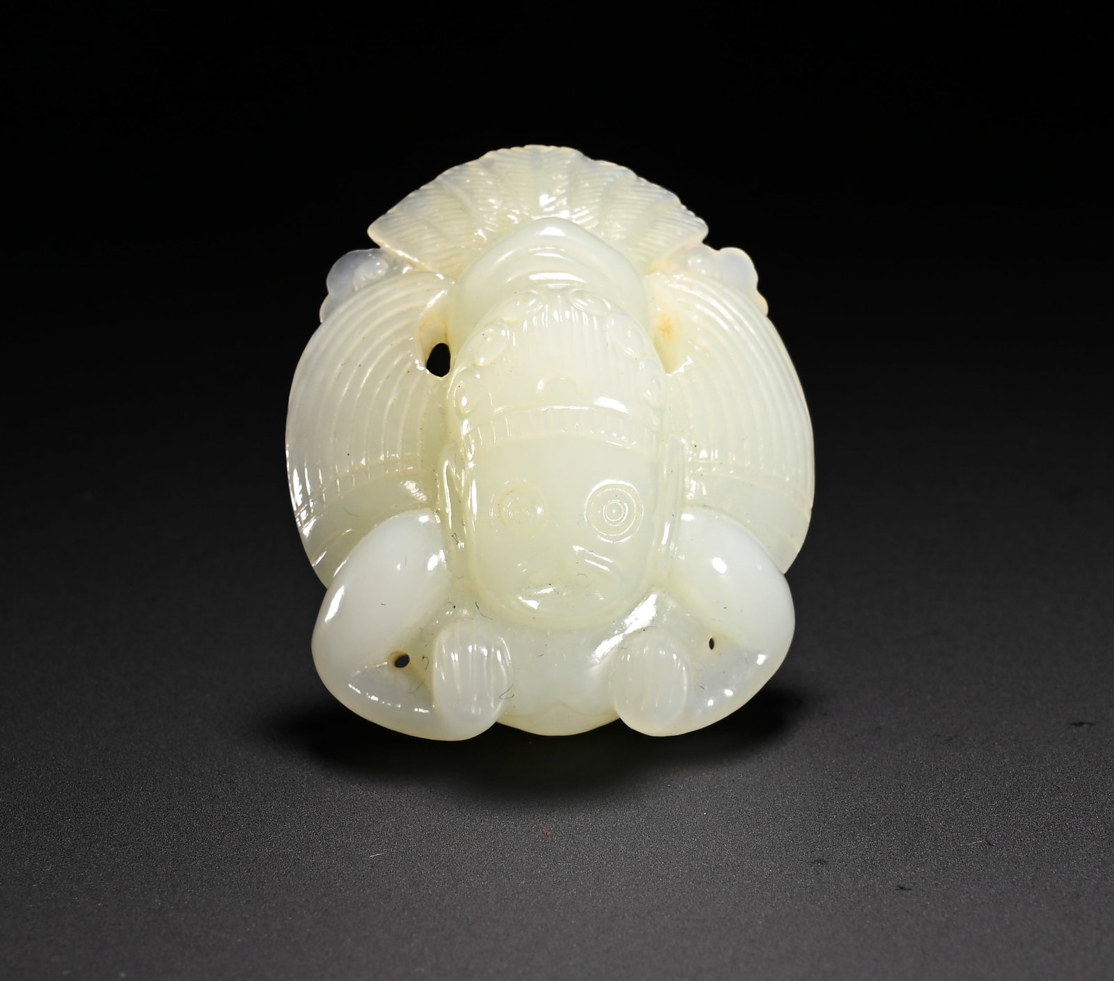 QING DYNASTY HETIAN JADE GARUDA PENDANT: Height:4.8cm(1.89in)Width:4cm(1.57in)Weight:40g(0.09lb)Qing Dynasty Hetian jade pendant of Garuda. Garuda, also known as the Golden-winged Great Bird, is depicted with a human face and avian body. Its
