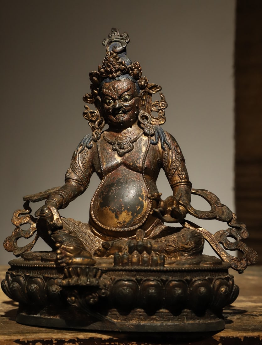 A STATUE OF THE YELLOW GOD OF WEALTH FROM THE QING DYNASTY (1 of 9)