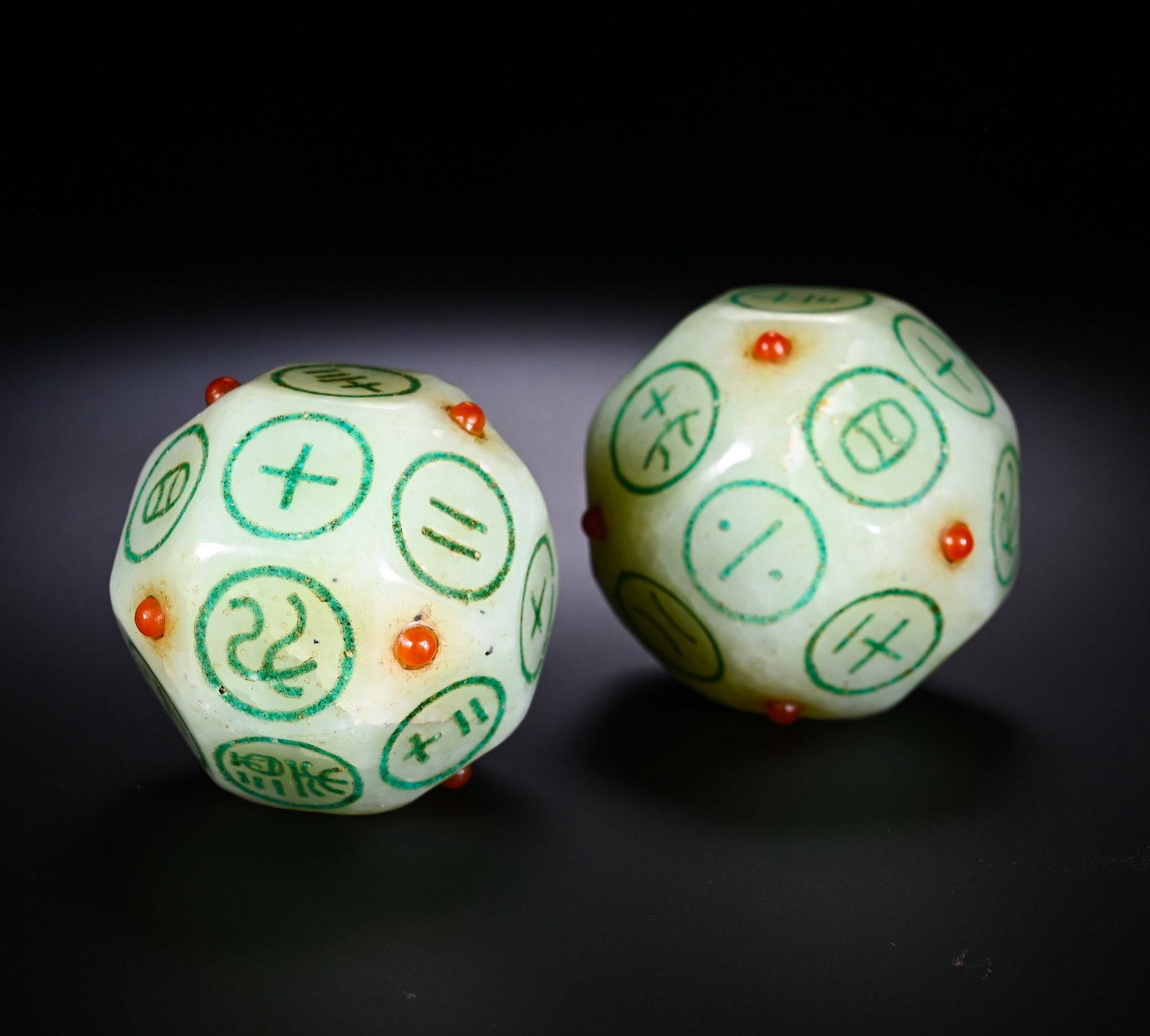HAN DYNASTY HETIAN WHITE JADE DODECAHEDRAL GAME DICE: D:4cmWeight:260gPair of twelve-sided gaming dice carved from Han Dynasty Hetian white seed jade. Fully polished single nephrite block with greasy texture, naturally formed earth patina and aged stains
