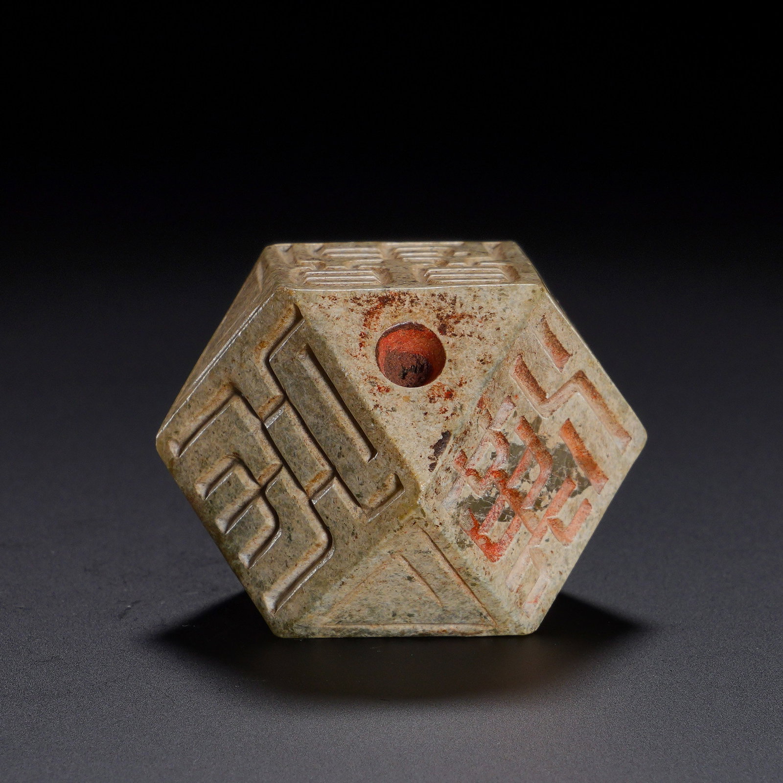 HAN DYNASTY HETIAN JADE BOQIONG: Height:2.9cm(1.14in) Width:3.5cm(1.38in) Weight:60g(0.13lb)Carved from archaic Hetian jade. Each facet bears incised ancient seal characters filled with cinnabar, and a suspension hole is drilled on t