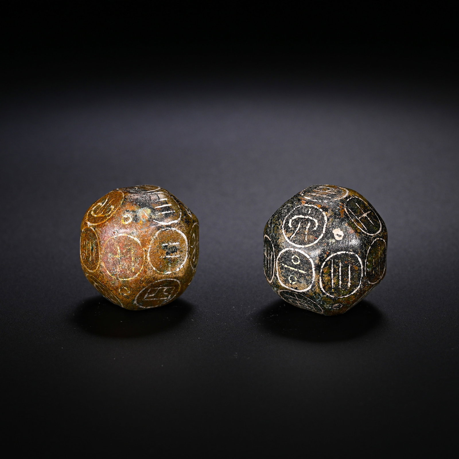 A PAIR OF BRONZE TWELVE-FACED BOQIONG FROM THE HAN DYNASTY