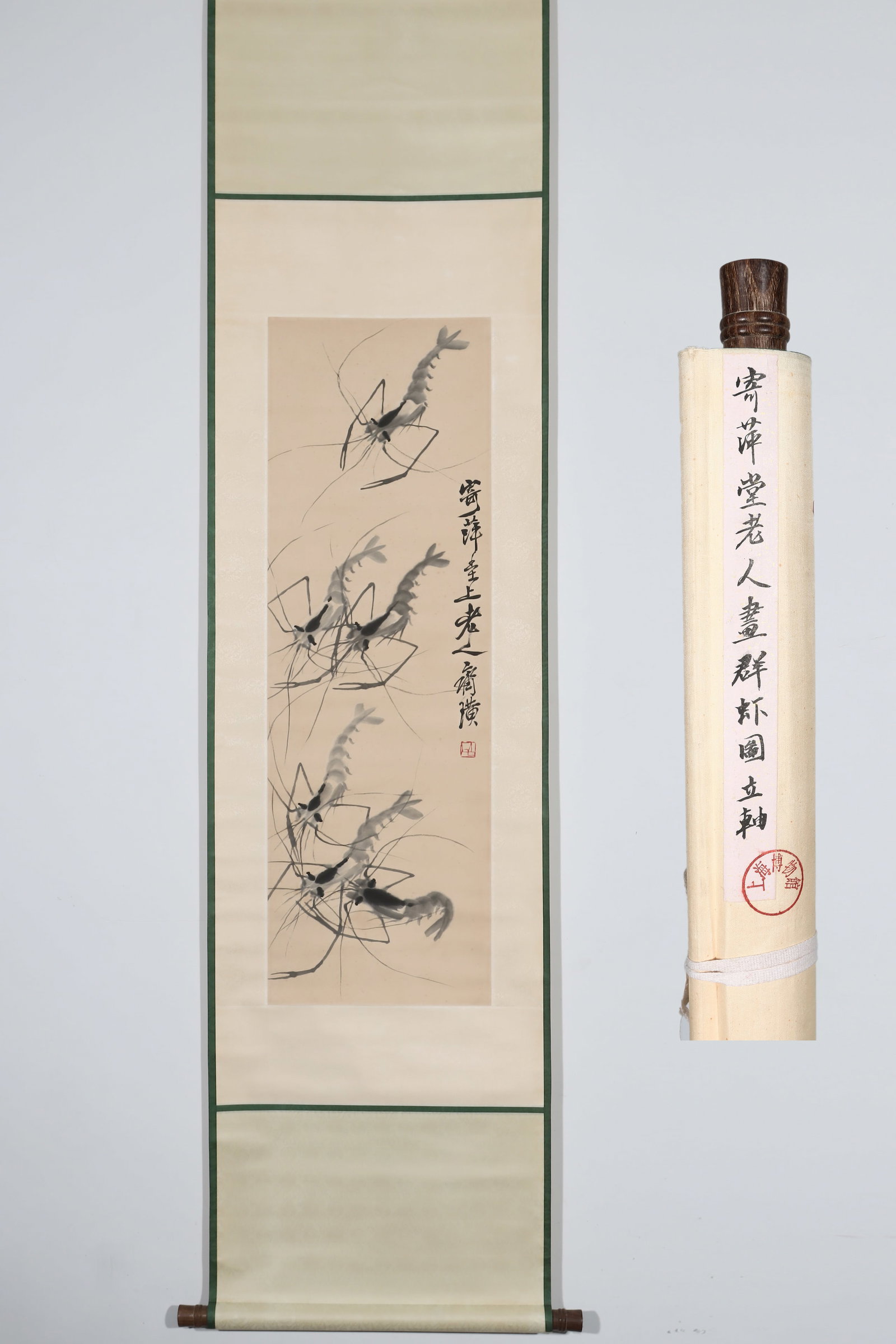A GROUP OF SHRIMPS BY QI BAISHI (1864-1957): Height:123cm(48.43in) Width:33.5cm(13.19in)Ink flower-and-bird vertical scroll on paper. The work depicts several shrimp swimming freely, rendered in vivid transparent ink brushwork. Poetic inscriptio