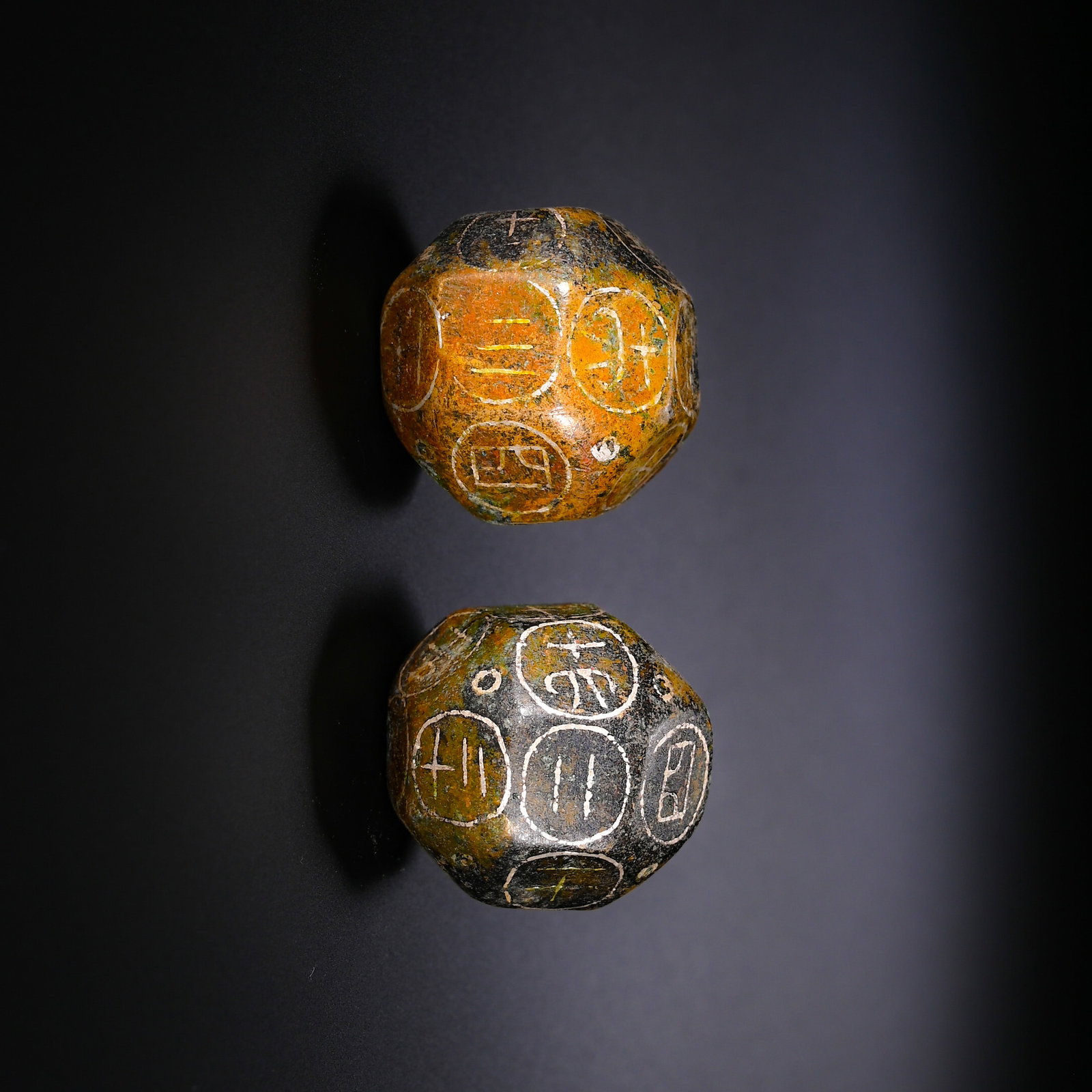 A PAIR OF BRONZE TWELVE-FACED BOQIONG FROM THE HAN DYNASTY