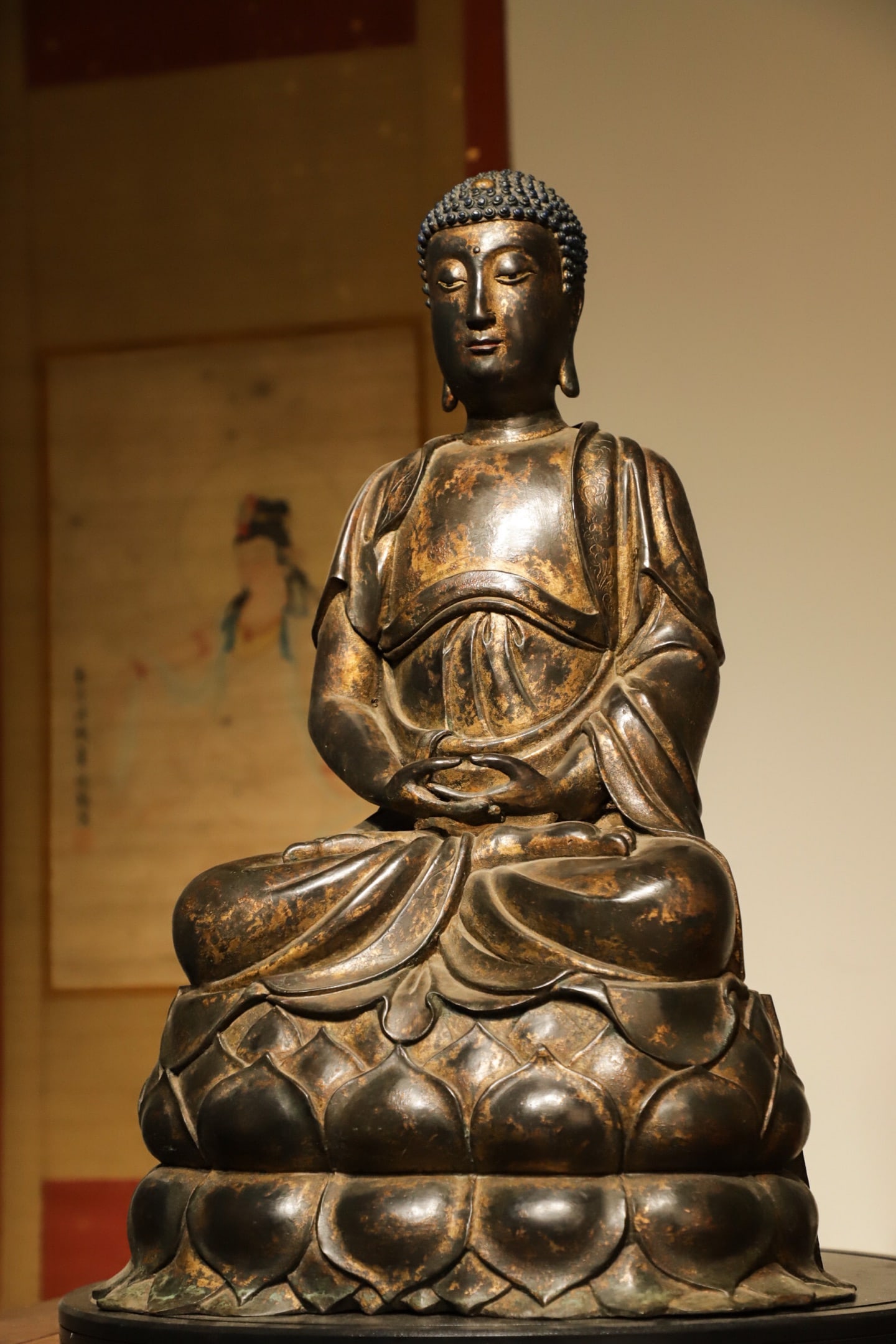 A SEATED STATUE OF SAKYAMUNI BUDDHA IN GILDED BRONZE CAST FROM THE MING DYNASTY