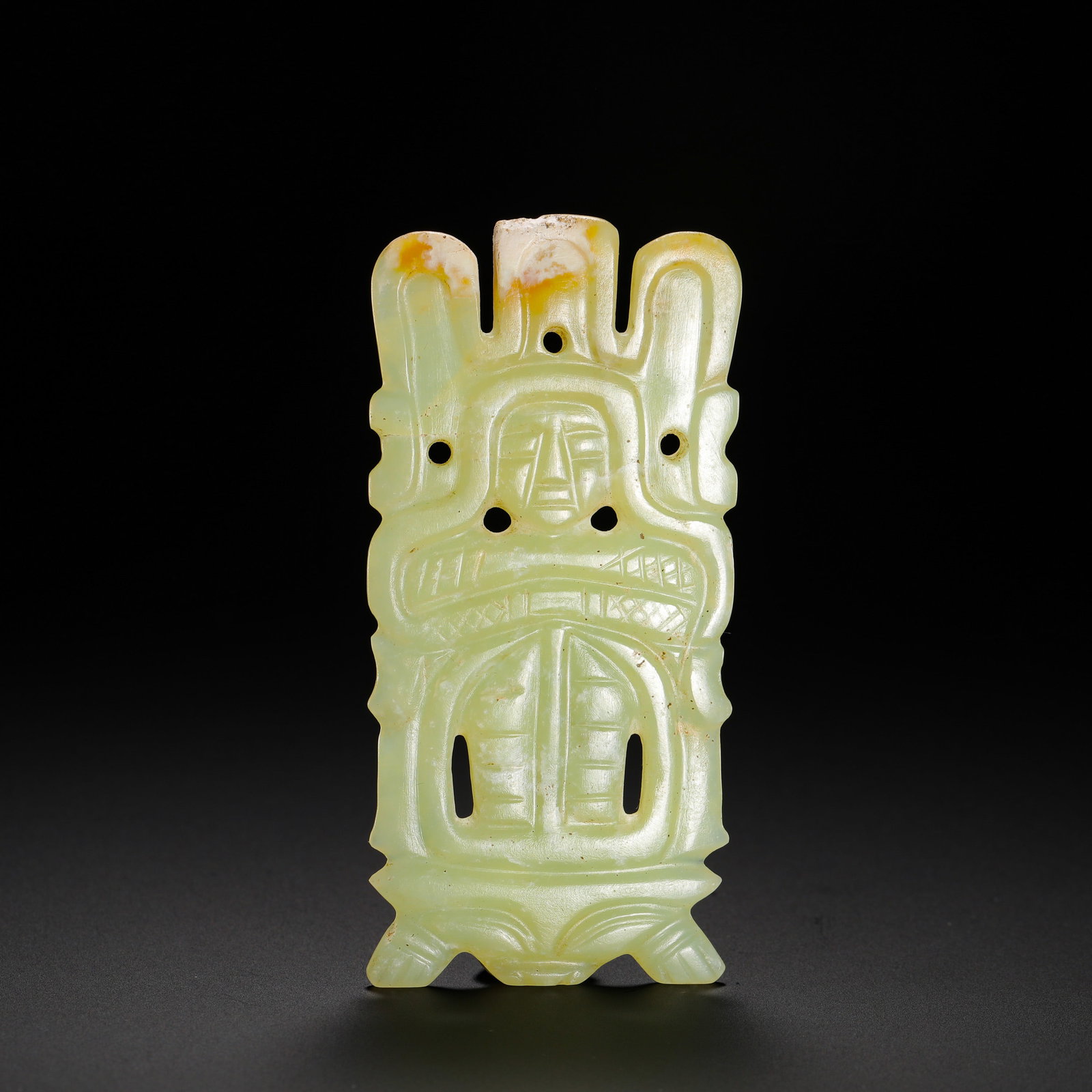 SHANG DYNASTY HETIAN JADE DIVINE PERSON PENDANT: Height:8.5cm(3.35in) Width:4cm(1.57in) Weight:30g(0.07lb)Shang-Zhou hollowed jade ritual pendant carved with deity and turtle patterns. Flat jade tablet with three-prong crown, central human face reli