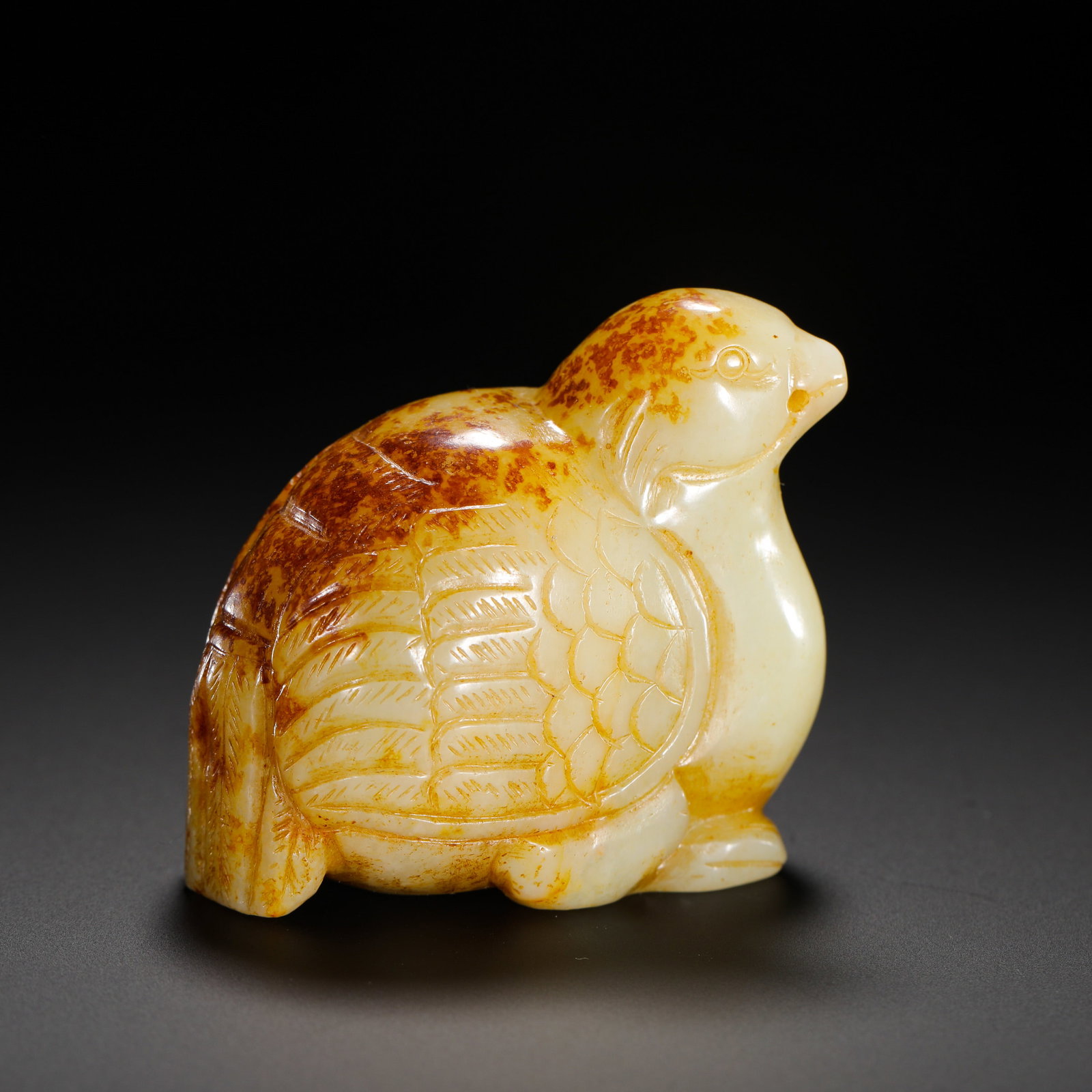 HETIAN WHITE JADE RED QUAIL OF THE QING DYNASTY: Height:5.5cm(2.17in) Width:6cm(2.36in) Weight:180g(0.40lb)Hetian white jade quail handheld ornament with natural red russet inclusions, Qing Dynasty.Carved from creamy fine white jade with large natur