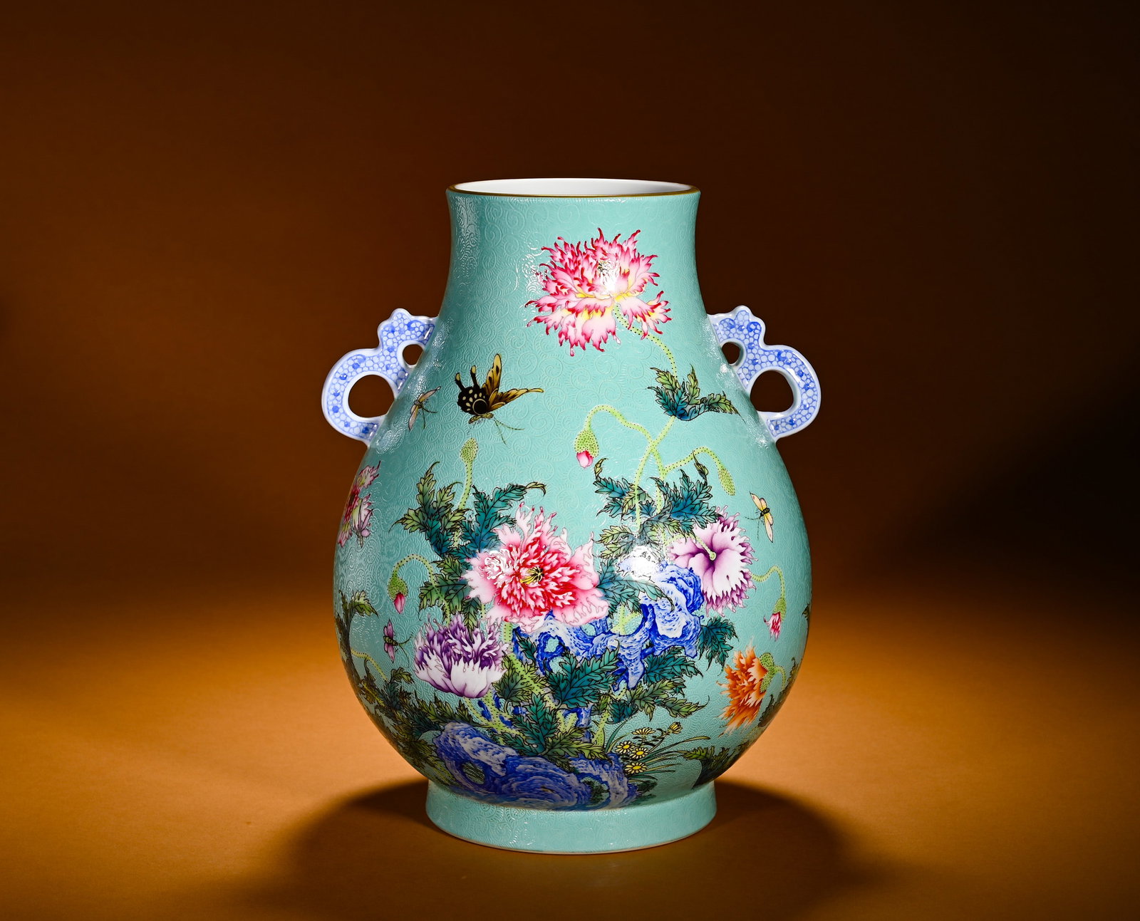 QING DYNASTY TURQUOISE GREEN POLYCHROME POPPY BUTTERFLY PATTERN DOUBLE-EARED VASE: Height:28cm(11.02in)Width:22cm(8.66in)Weight:2240g(4.94lb)Famille rose covered vase with poppy and butterfly on turquoise incised ground. Modified deer-head shape of Yongzheng reign, narrow mouth, plu