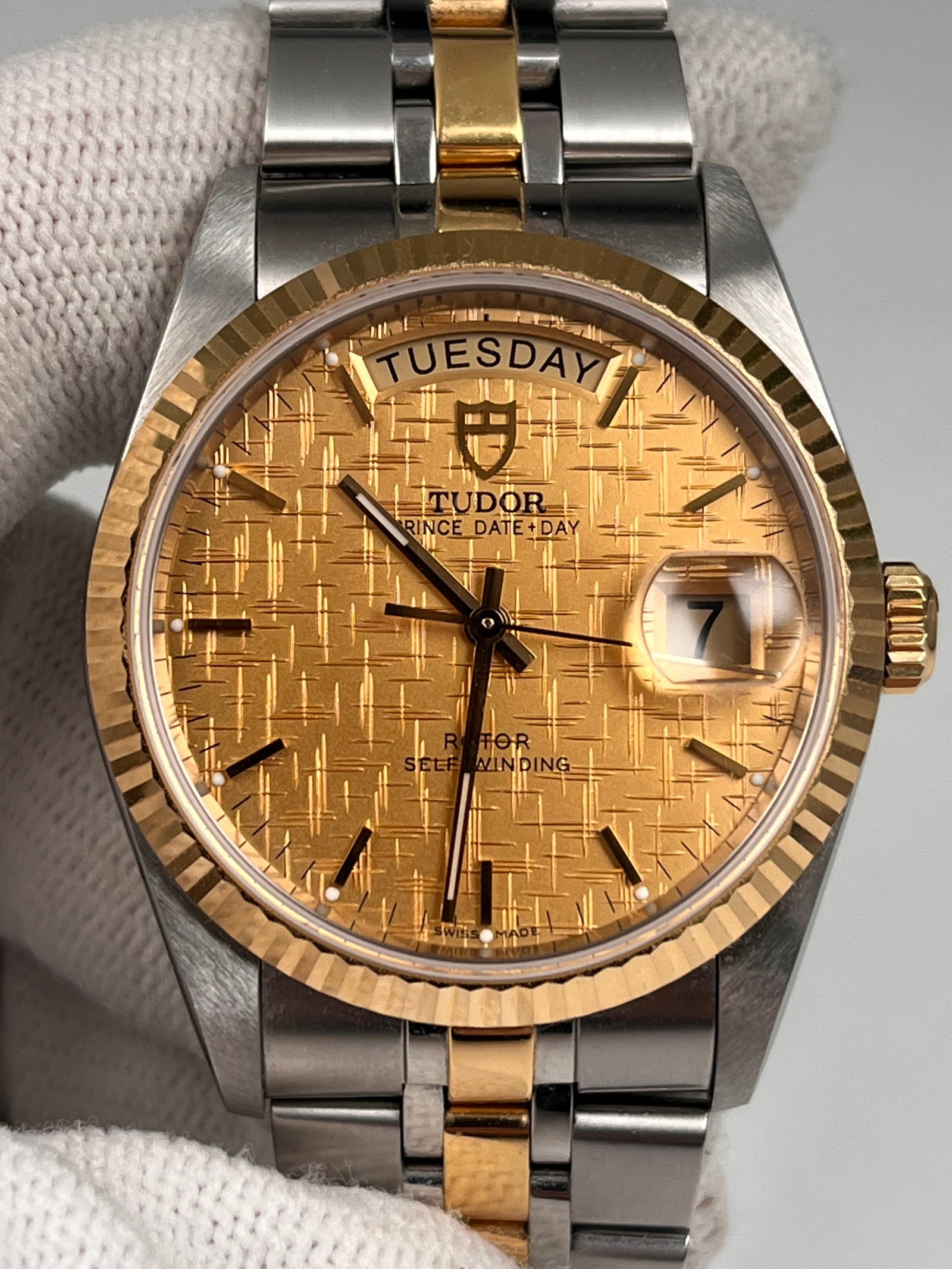 Tudor Prince & Princess Automatic Mechanical Men: 38-hour power reserve, 36mm stainless steel case with champagne-colored silk dial, baton hour markers, 18k gold fluted bezel, water-resistant up to 100 meters