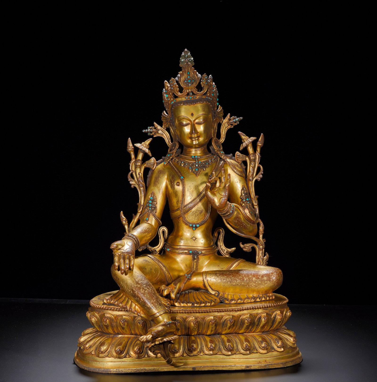 18th-century gilded bronze statue of Tara: Height:61cm(24.02in), Width:43cm(16.93in), Weight:22600g (49.822lb)Gilt Bronze Seated Green Tara with Tibetan Inscription on Lotus BaseThis gilt bronze Green Tara sits in the canonical lalitasana post