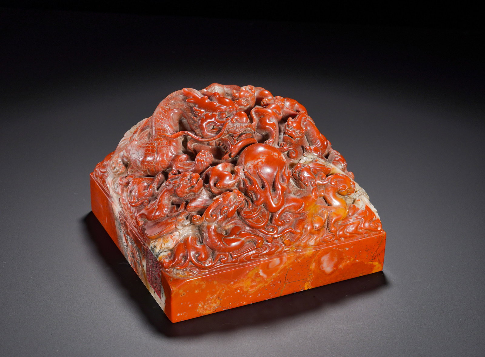 Qing Dynasty Shoushan Stone Nine Dragons Playing with Pearls Imperial Seal: Height:12cm(4.72in), Width:16cm(6.30in), Weight:5190g (11.442lb)Large Shoushan Stone Imperial Seal Carved with Dragons Chasing PearlCarved from substantial red Shoushan stone in square form. The knob 