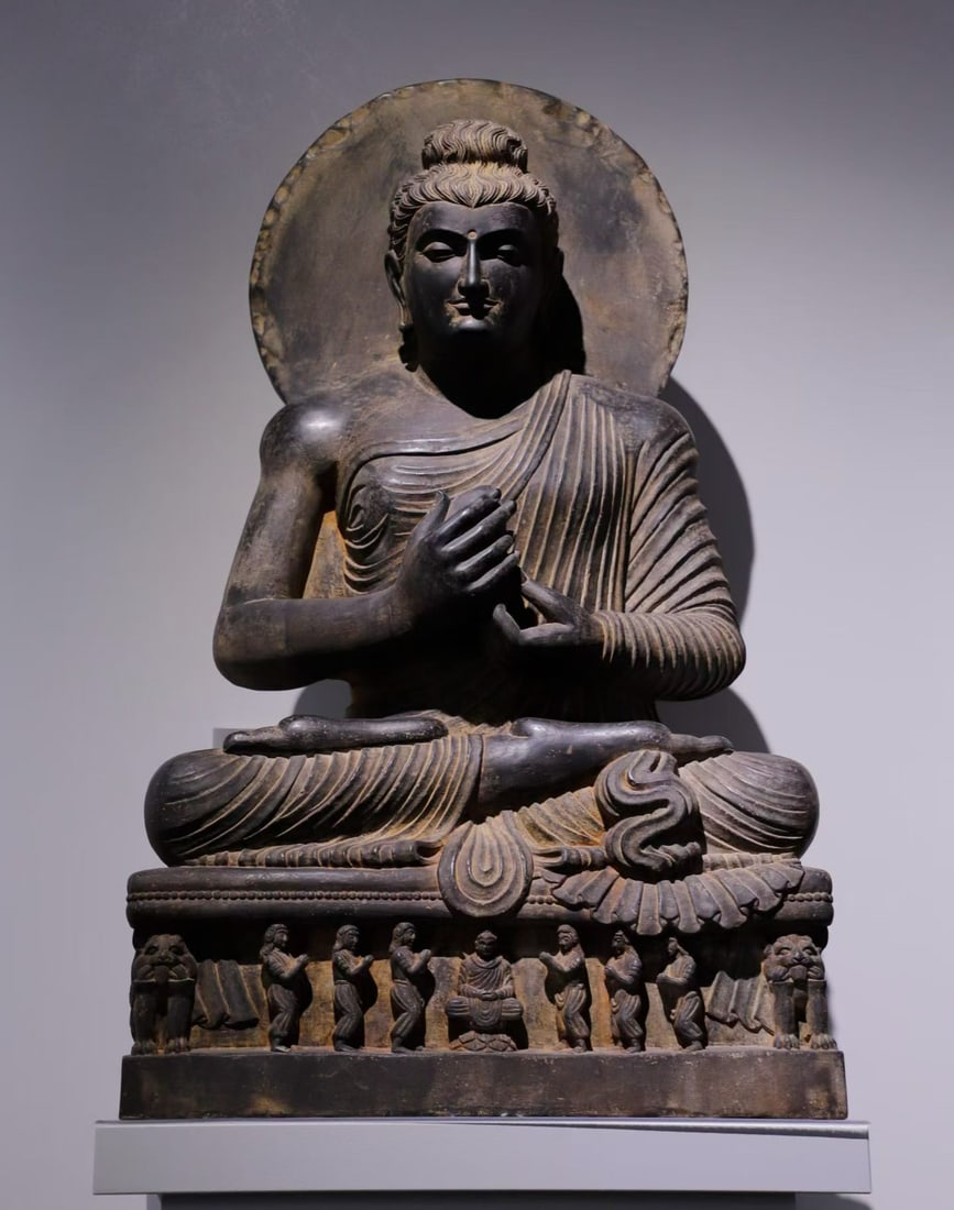 A seated statue of Sakyamuni preaching in Gandhara from the 4th century (1 of 9)