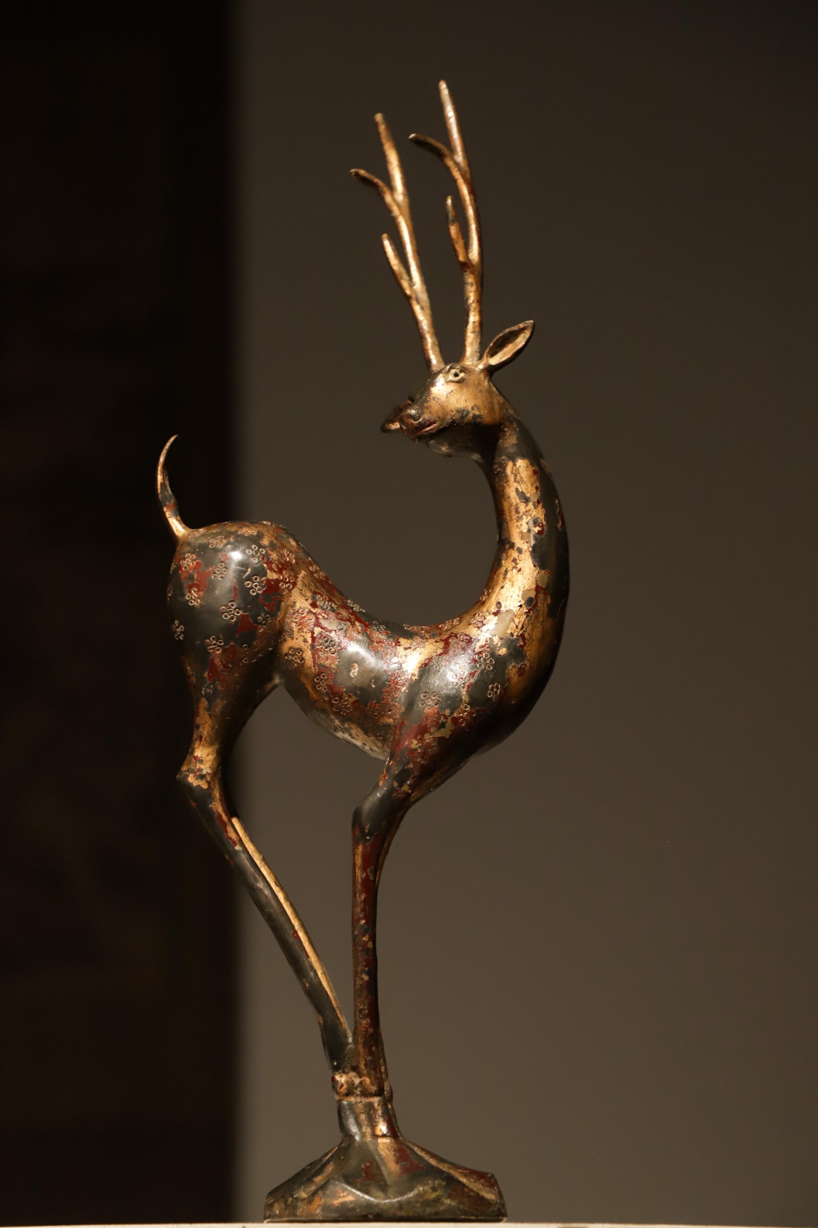 Bronze lacquered golden sika deer of the Qing Dynasty: Height:40cm(15.75in) Width:15cm(5.91in) Weight:1350g(2.98lb)Antique bronze gilded deer sculpture, plum blossom carved body, aged lacquer, symbolizing wealth and longevity