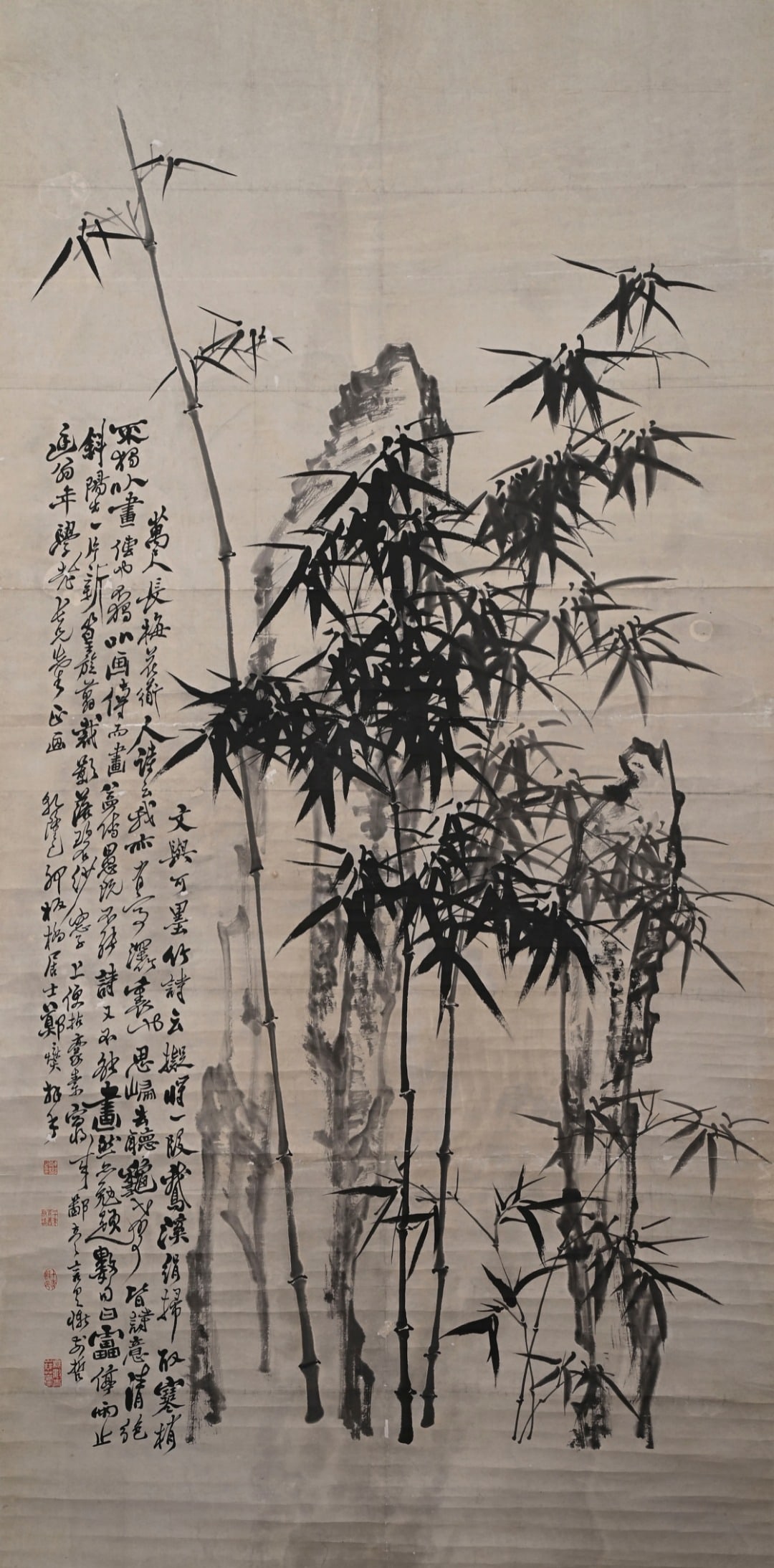 Qing Dynasty Zheng Banqiao (1693-1765) Bamboo and Stone Scroll: Height:243cm(95.67in), Width:120cm(47.24in)Hanging scroll, ink on paper, by Zheng Xie (Banqiao).Tall bamboo stalks rise amid jagged rock formations. Brushwork for leaves borrows strokes from running c