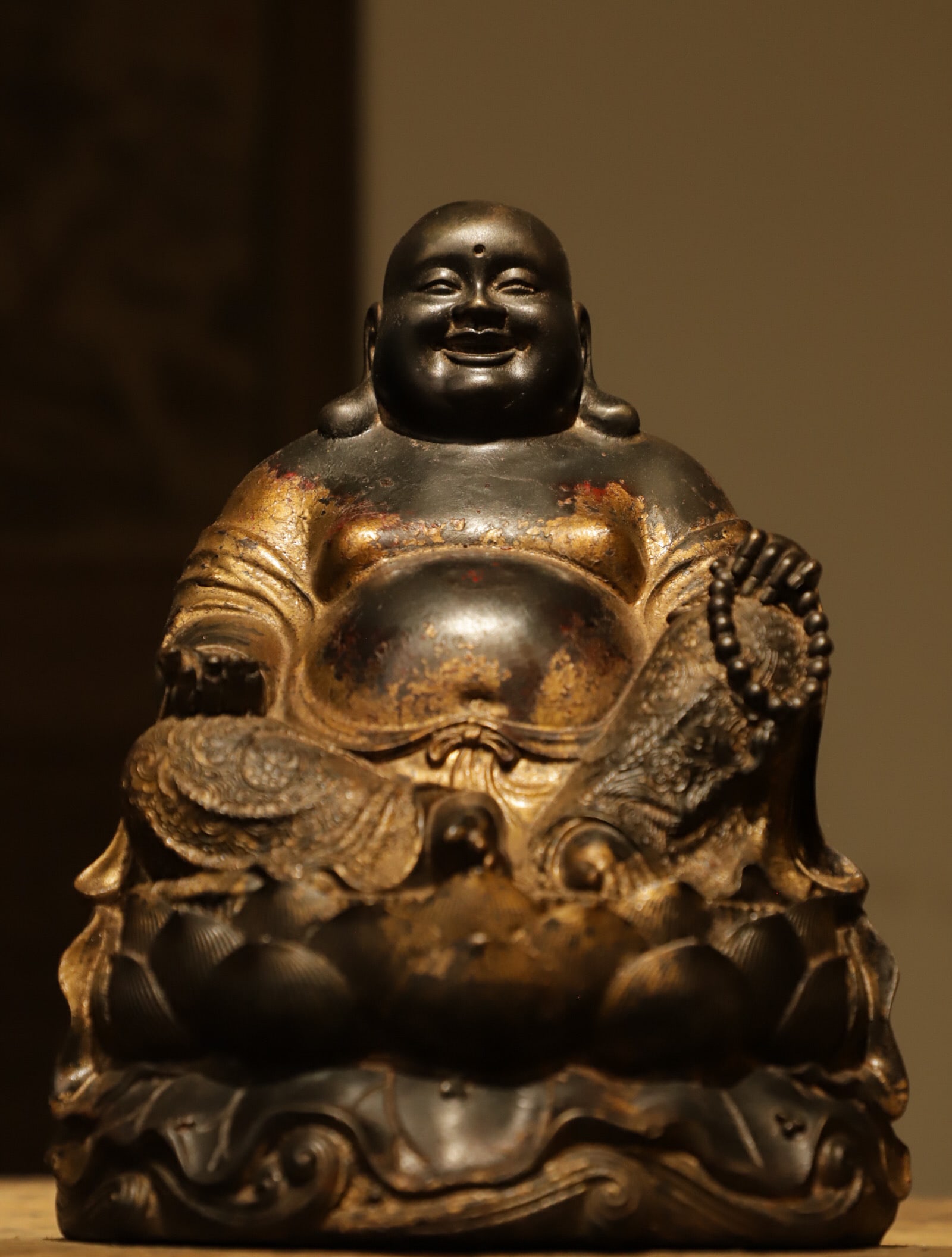 Laughing Buddha, Big Bellied Maitreya Buddha of the Qing Dynasty: Height:26cm(10.24in), Long:19cm(7.48in), Width:18cm(7.09in), Weight:3655g (8.058lb)Bronze statue with aged gilded coating. The Maitreya has a plump face with a joyful smile and thick earlobes. With a 
