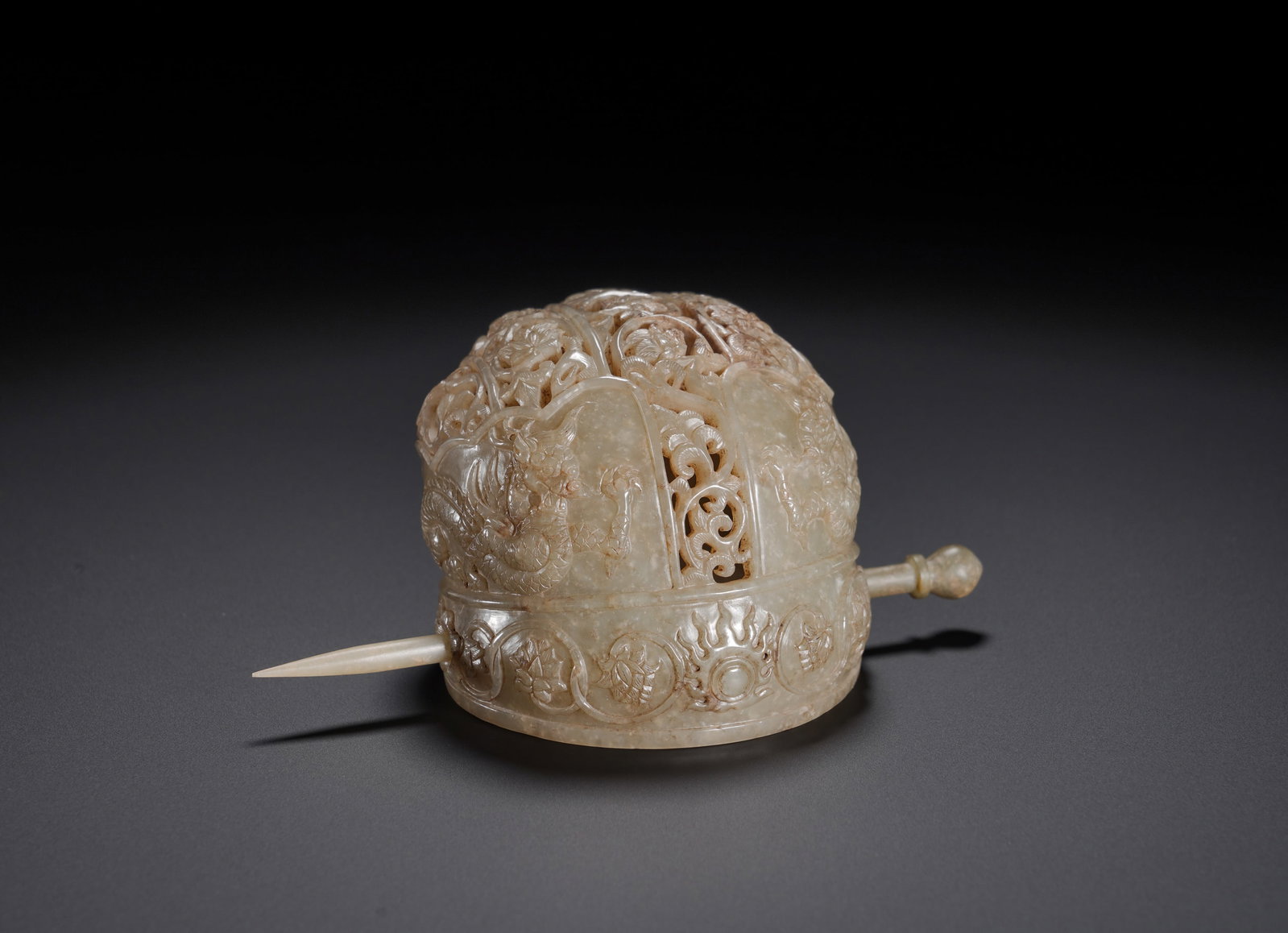 Tang Dynasty Hetian jade through-carved dragon pattern hair crown: Height:7cm(2.76in), Width:12cm(4.72in), Weight:140g (0.309lb)White Jade Openwork Hair Crown Carved with Dragon and Eight Auspicious Symbols, Complete with Original Jade HairpinThis set consists of a