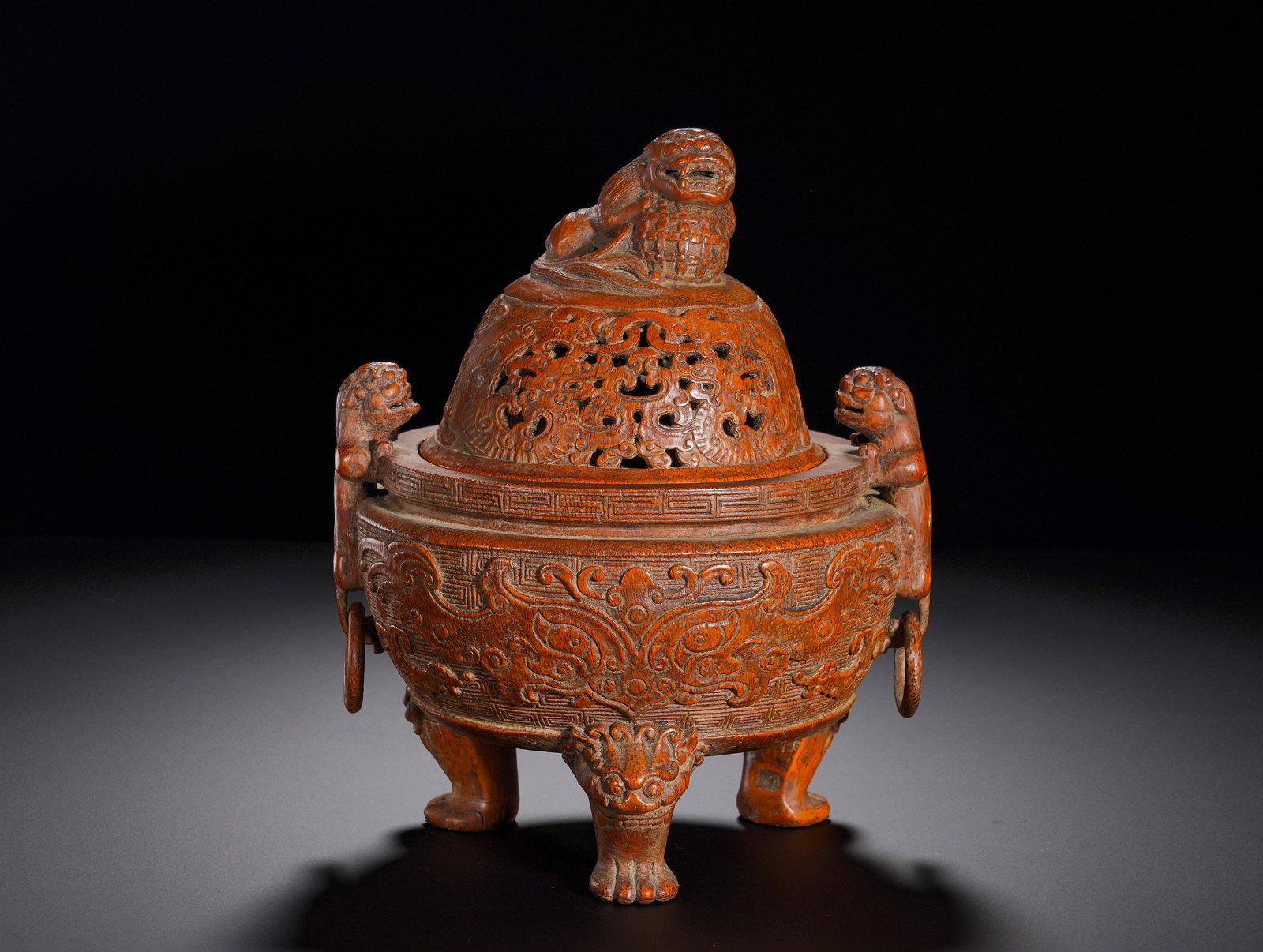 Qing Dynasty bamboo-carved beast knob taotie pattern incense burner: Height:22cm(8.66in), Width:18cm(7.09in), Weight:710g (1.565lb)Bamboo Censer with Lion Knob, Taotie Mask Pattern, Twin Lion Handles and Three Beast FeetEntirely carved from aged bamboo in archaic bronz
