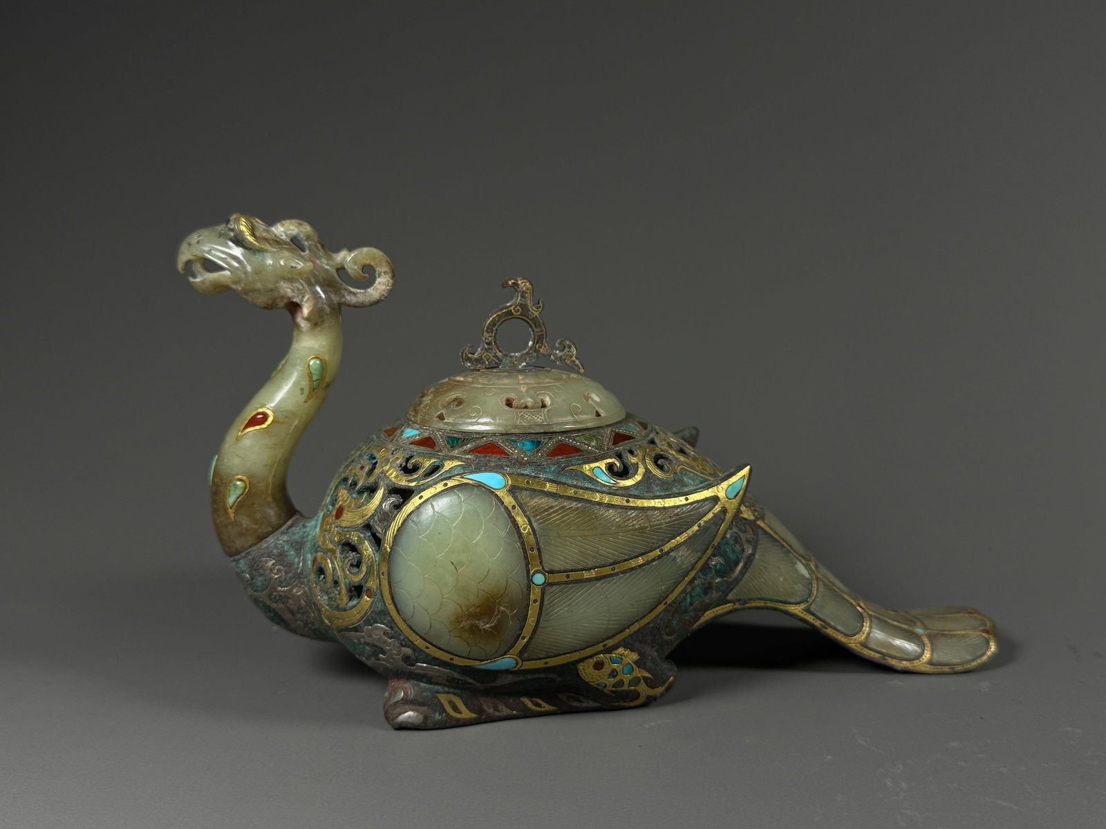 Han bronze incense burner with inlaid gold and silver inlaid jade and gemstones for the divine bird: Height:12cm(4.72in), Width:21cm(8.27in), Weight:802g (1.768lb)Han Dynasty Bronze Incense Burner in Shape of Divine Bird, Gold & Silver Inlaid with Jade and GemstonesMulti-craft incense vessel fully mo