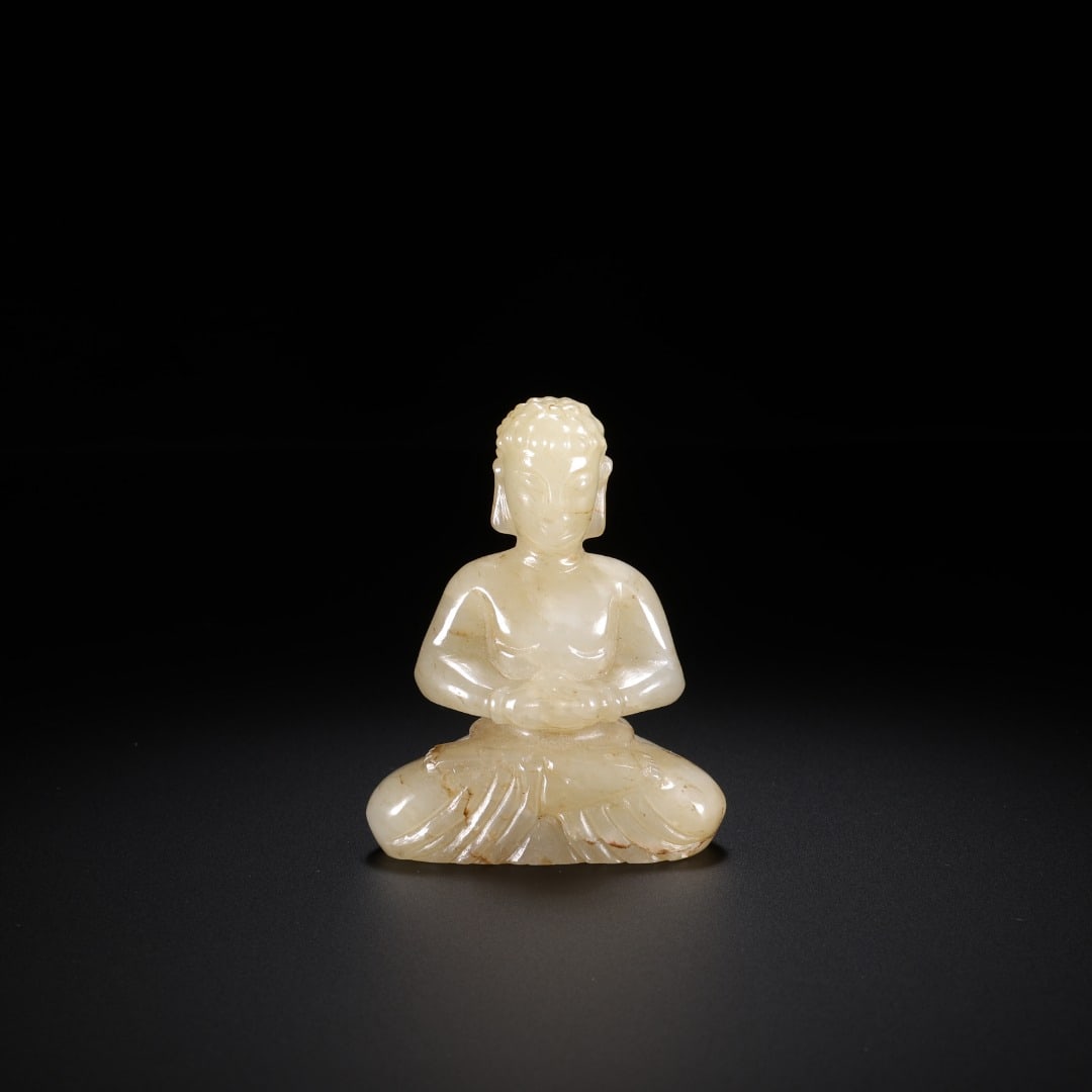 Han Dynasty Hetian jade Seated Buddha: Long:4.1cm(1.61in), Width:2cm(0.79in), Height:5.2cm(2.05in), Weight:43g (0.095lb)Ancient jade seated statue of Sakyamuni Buddha. Carved from Hetian jade with natural weathered veins. The Buddha sits