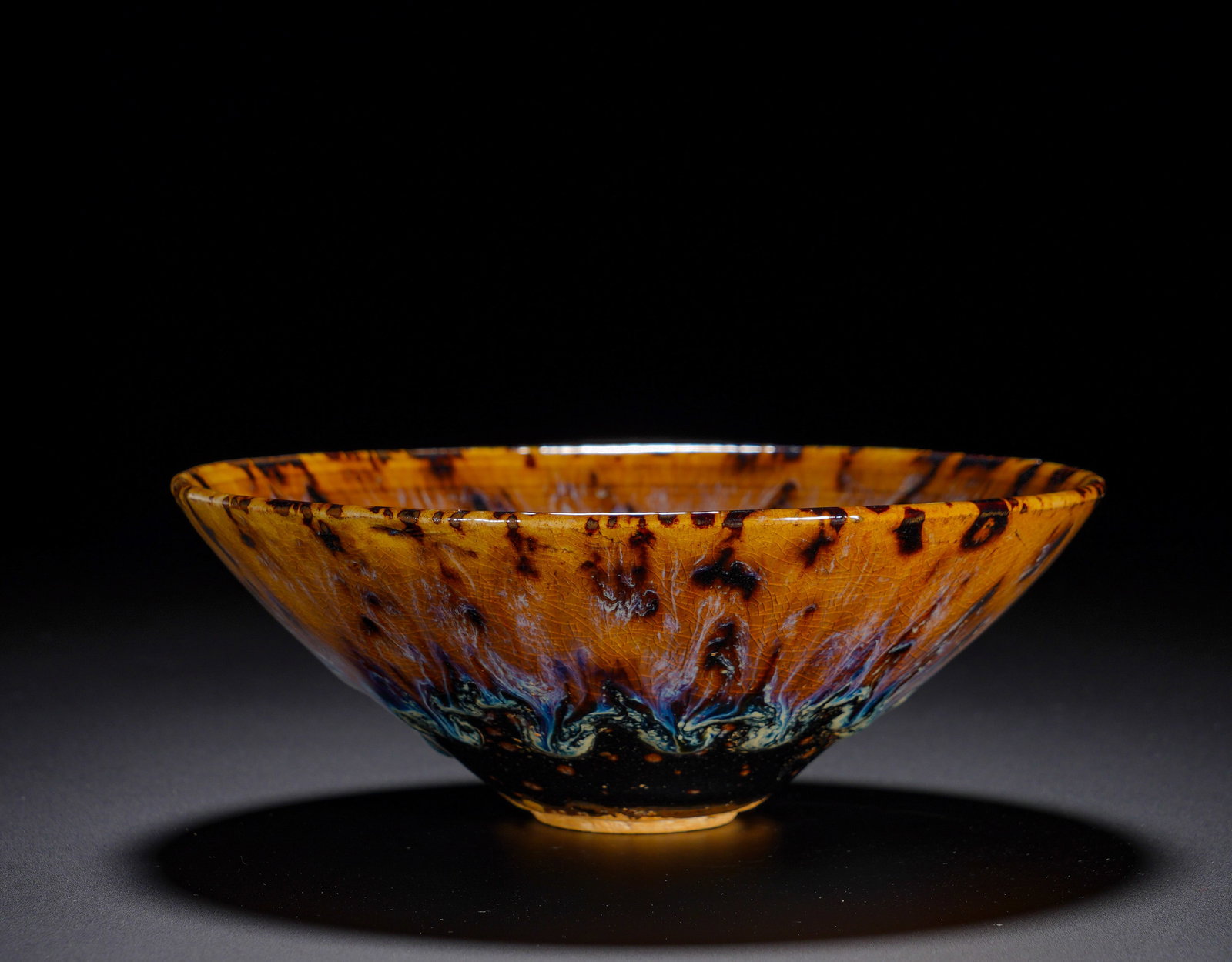 A Song Dynasty Jizhou kiln tortoiseshell glaze kiln-transformed bamboo hat bowl: Height:6cm(2.36in), Diameter:14.5cm(5.71in), Weight:260g (0.573lb)Hawksbill glaze is one of the celebrated specialties of Song Jizhou kiln. The gorgeous mottled effect arises naturally in firing