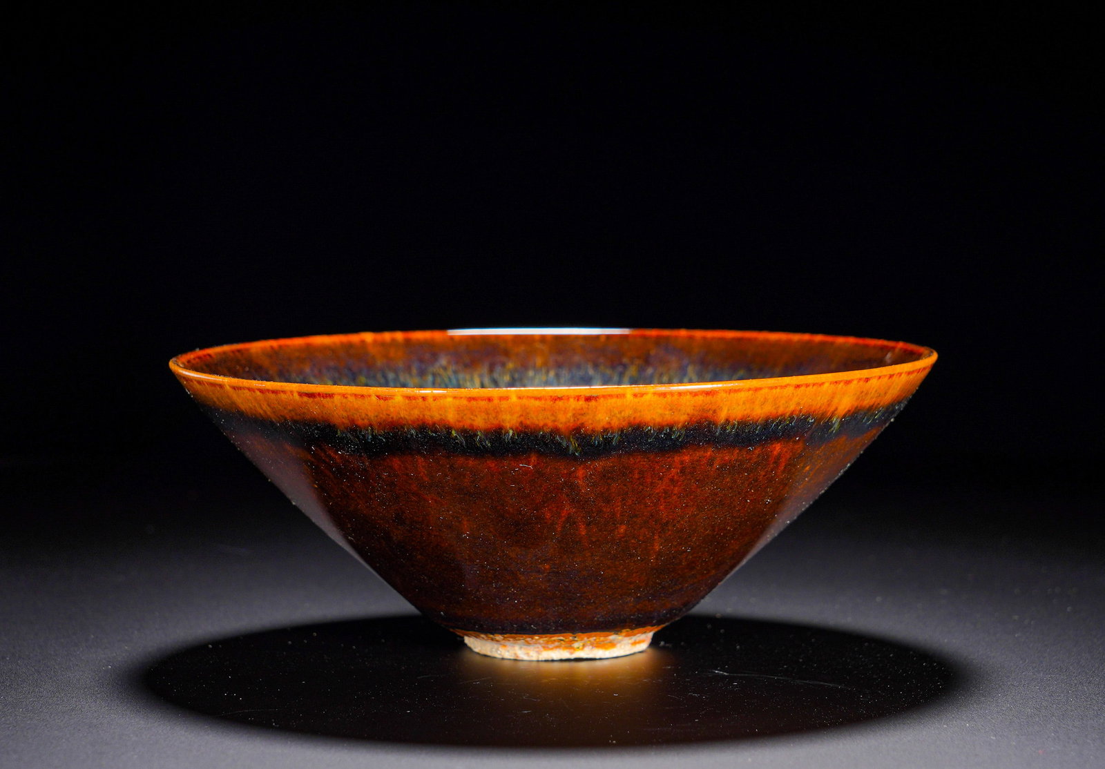 Song Dynasty Jizhou Kiln sauce glaze kiln-transformed bamboo hat bowl: Height:7cm(2.76in), Diameter:16cm(6.30in), Weight:330g (0.728lb)Jizhou Kiln Russet-Glazed Conical Tea BowlModelled in the classic Song-dynasty conical shape, the bowl features wide flared rim,