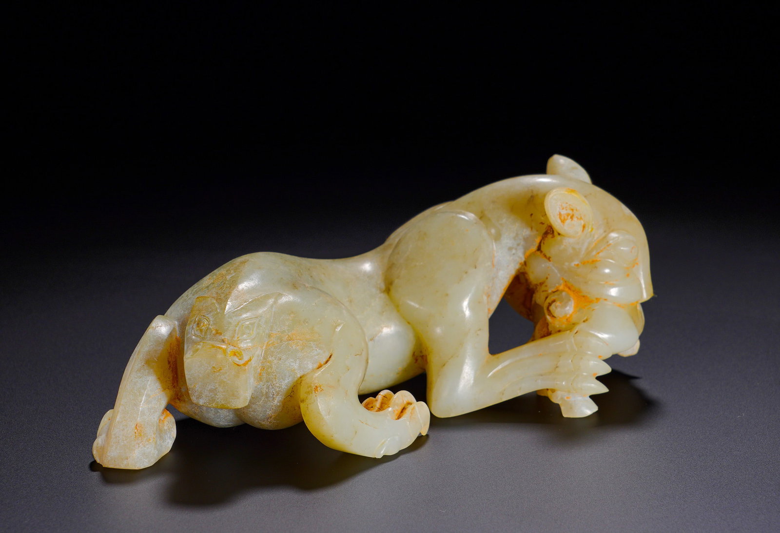 Han Dynasty Hetian jade with auspicious chi beast: Height:7cm(2.76in), Width:17cm(6.69in), Weight:710g (1.565lb)Chilong beasts were revered auspicious emblems in antiquity, symbolizing the dispelling of malign influences and attracting good fortune.