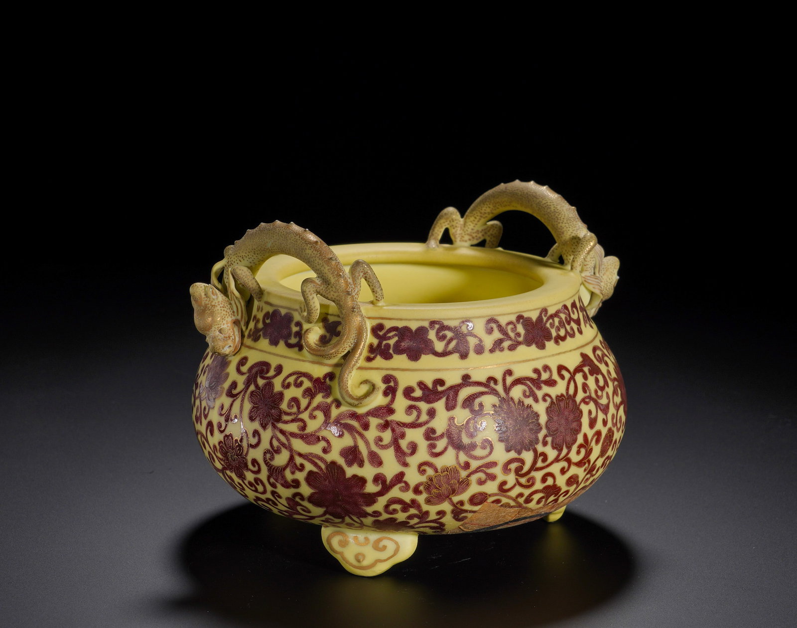 Qing Dynasty Yongzheng Yellow ground carmine red gilded entwined lotus stove: Height:12cm(4.72in), Diameter:16cm(6.30in), Weight:750g (1.653lb)Modelled after ancient bronze ding vessels, this censer features wide mouth, rounded belly and three ruyi-shaped feet. A pair of
