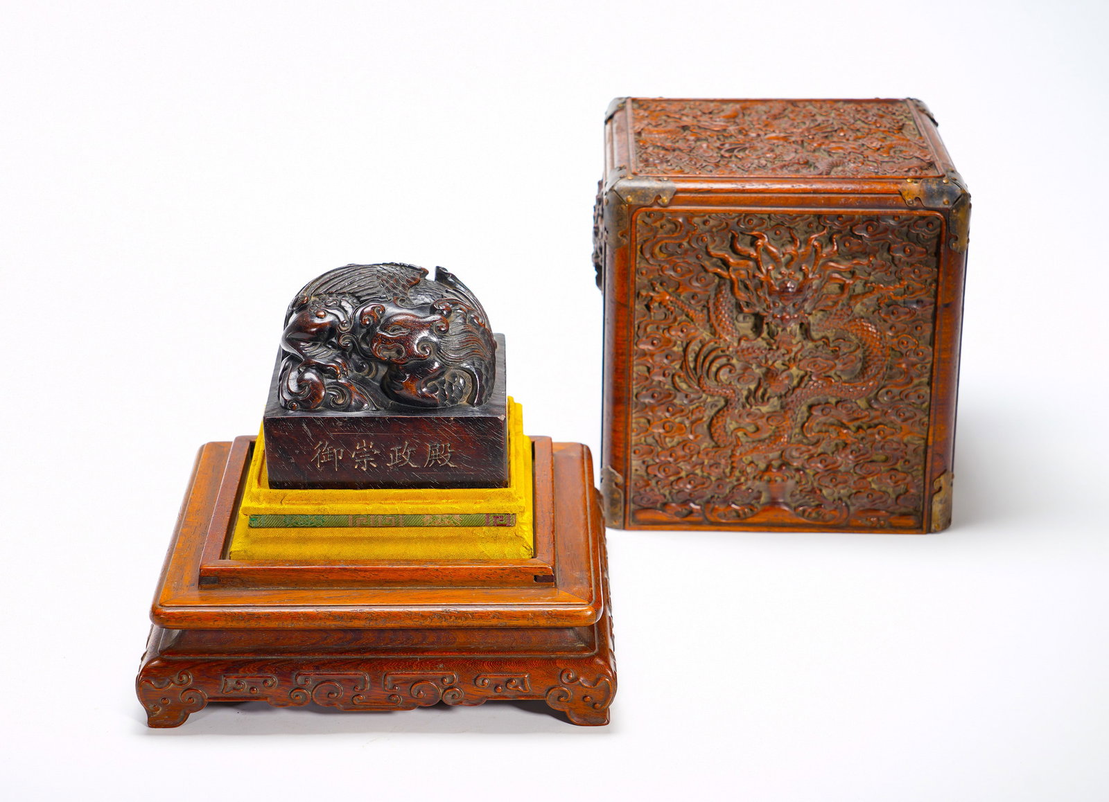 Imperial Dragon and Phoenix Button Seal of the Chongzheng Hall of the Qing Dynasty: Height:22cm(8.66in), Width:18.5cm(7.28in), Weight:2530g (5.578lb)Zitan Imperial Seal with Phoenix-Dragon Knob, Accompanied by Cloud-Dragon Carved Wood Casing and Ornate StandCrafted from a