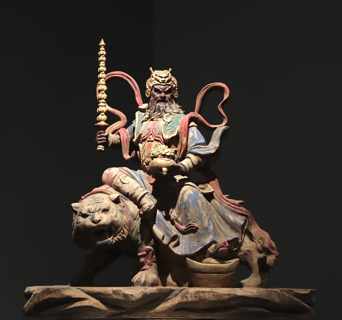 The Song Dynasty woodcarving painted image of the God of Wealth riding a tiger: Height:100cm(39.37in), Width:98cm(38.58in), Thick:44cm(17.32in)Wood painted statue of God of Wealth Zhao Gongming riding a tiger. Wearing warrior helmet, stern facial features with long beard,