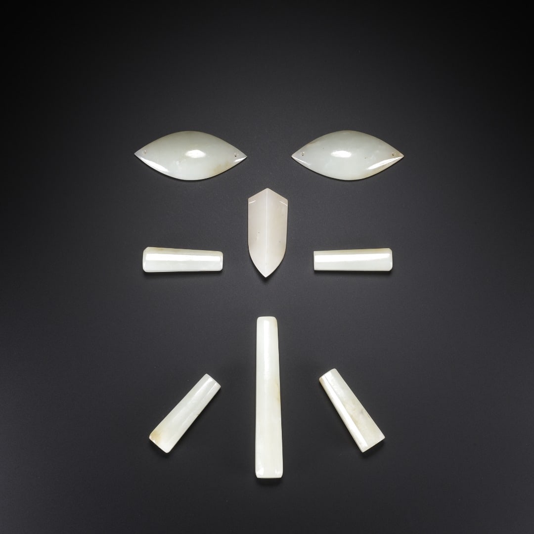 A set of nine plugs made of Hetian jade from the Han Dynasty: Long:4.9cm(1.93in), Width:2.2cm(0.87in), Thick:0.8cm(0.31in), Weight:81g (0.179lb)Crafted from delicate Hetian white jade. This set consists of seven pieces belonging to jade nine-orifice stoppers, in