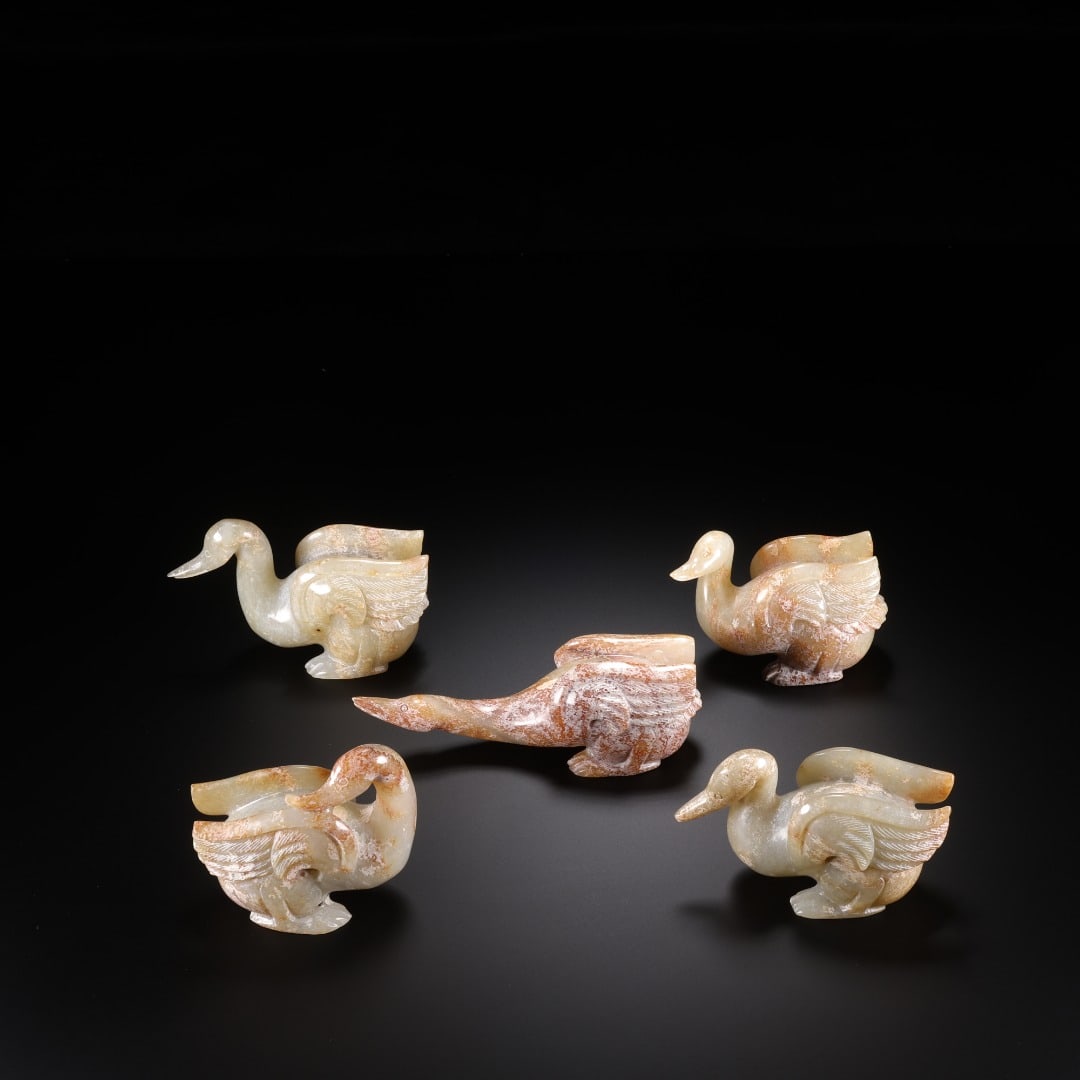 A set of Han Hetian jade Five Geese: Long:8.5cm(3.35in), Width:3.5cm(1.38in), Height:5.8cm(2.28in), Weight:150g (0.331lb), Weight:732g (1.614lb)This set includes five geese carved from Hetian jade. The jade is mellow with natural brownis