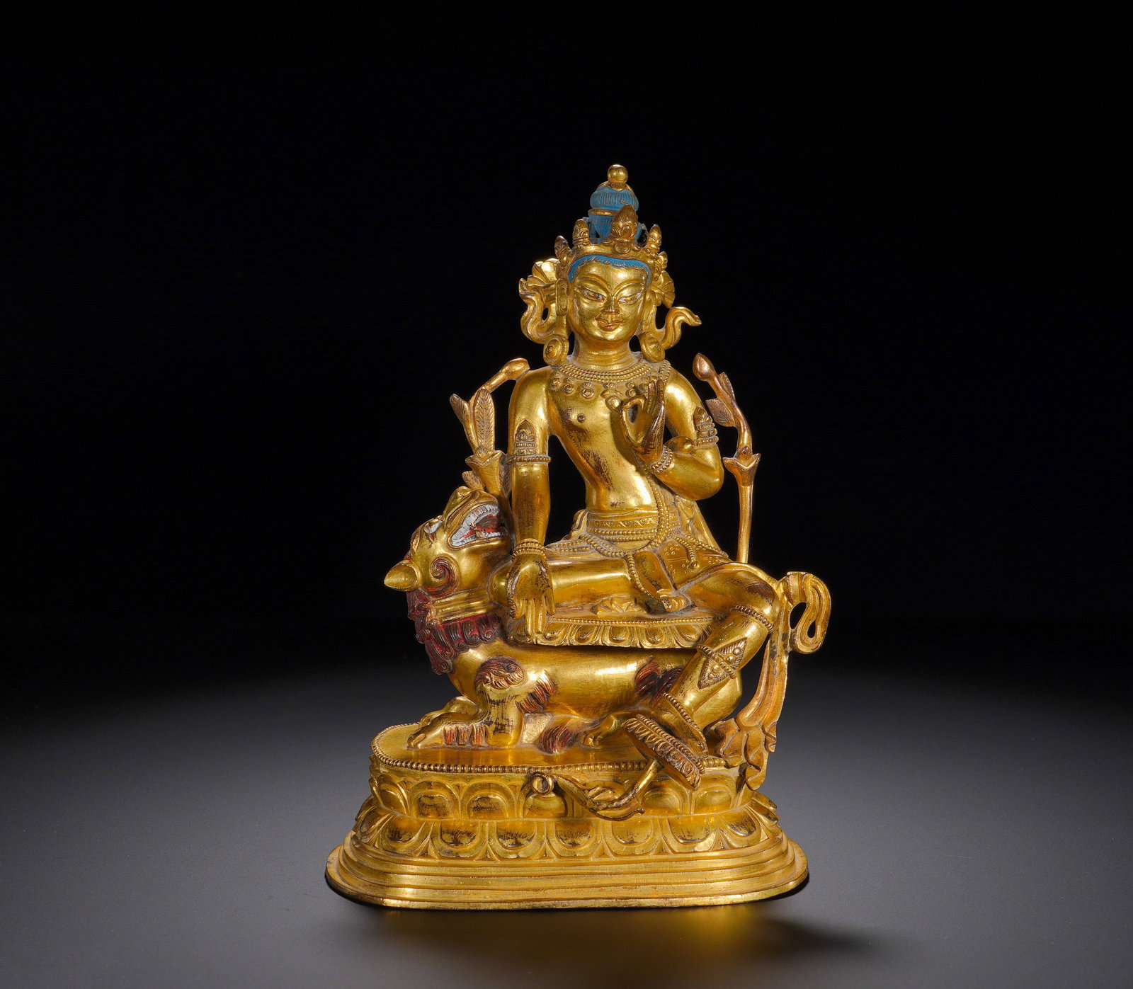 A gilded bronze statue of Manjusri Bodhisattva riding a lion from the Qing Dynasty (1 of 10)