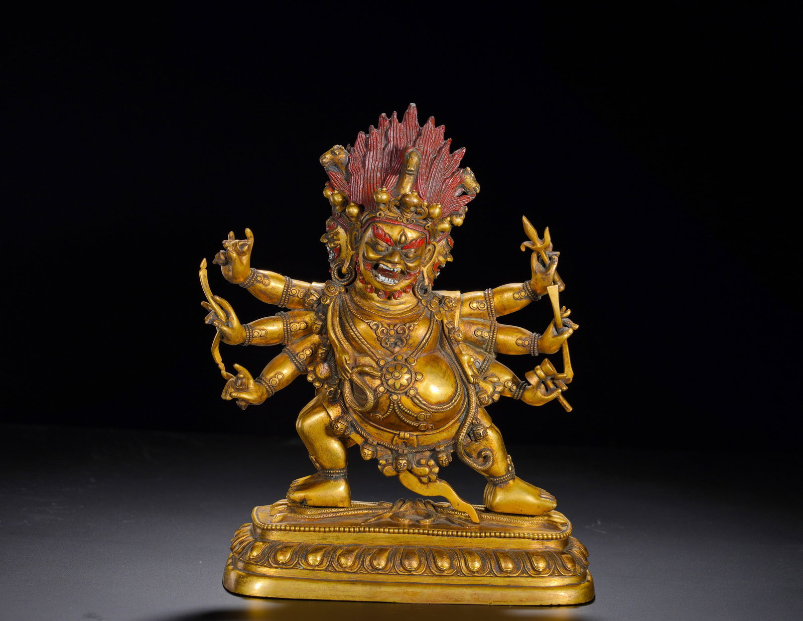 A standing figure of a six-armed horse-head Vajra in gilded bronze from the Qing Dynasty: Height:25cm(9.84in), Width:19cm(7.48in), Weight:3620g (7.981lb)Gilt Bronze Three-Faced Six-Armed MahakalaThis fully gilt bronze statue of three-faced six-armed Mahakala retains original mineral pigmen