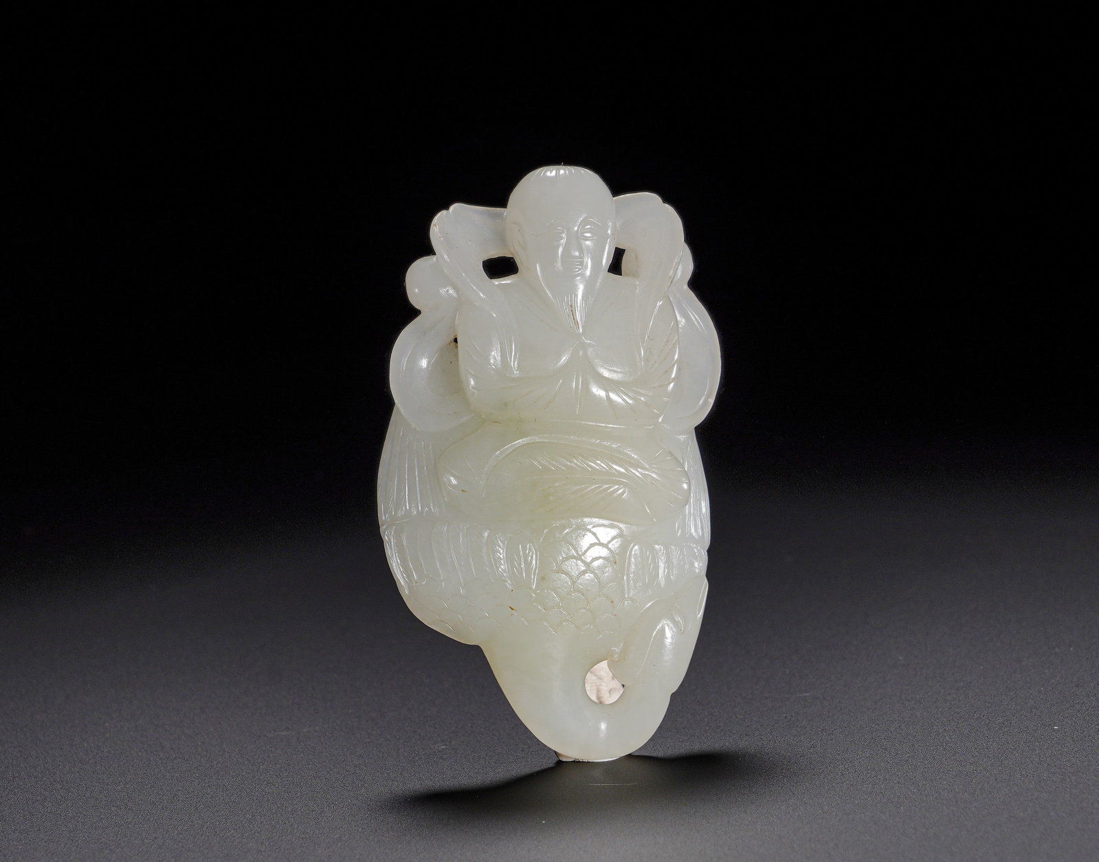 Qing Dynasty Hetian jade Immortal Wearing a crane pendant: Height:7.6cm(2.99in), Width:4.3cm(1.69in), Weight:60g (0.132lb)Hetian White Jade Pendant: Immortal Riding CraneCarved from fine Hetian white jade with mild, pure texture and subtle sheen. Combining op