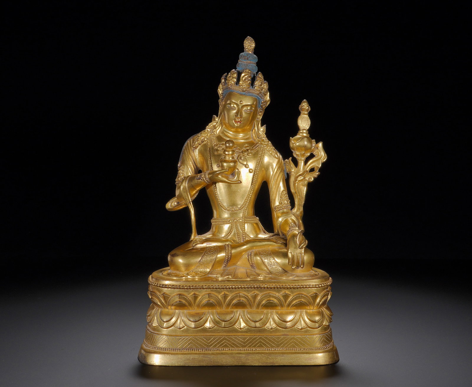 Gilded bronze statue of the Medicine Buddha from the Qing Dynasty: Height:27cm(10.63in), Width:17cm(6.69in), Weight:3240g (7.143lb)This Medicine Buddha is modelled in bodhisattva form, wearing an ornate crown with blue pigment retained on the ushnisha. The gentle rou