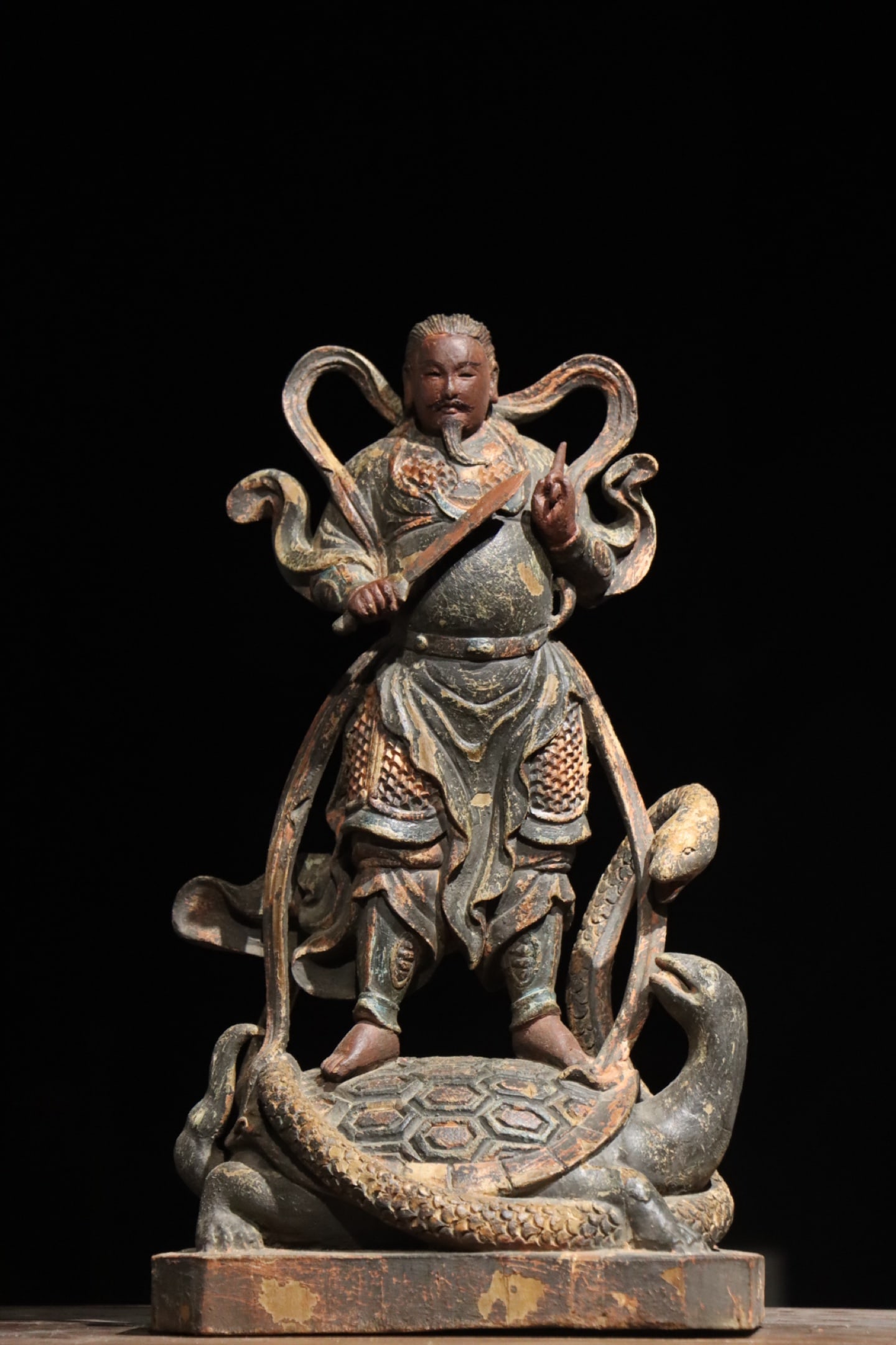 Song Dynasty woodcarving painted statue of Emperor Xuanwu: Height:42cm (16.54in)Wooden painted statue of Xuanwu Emperor, wearing scaled armor, holding sword, standing on turtle and snake, traditional Chinese Taoist sculpture.
