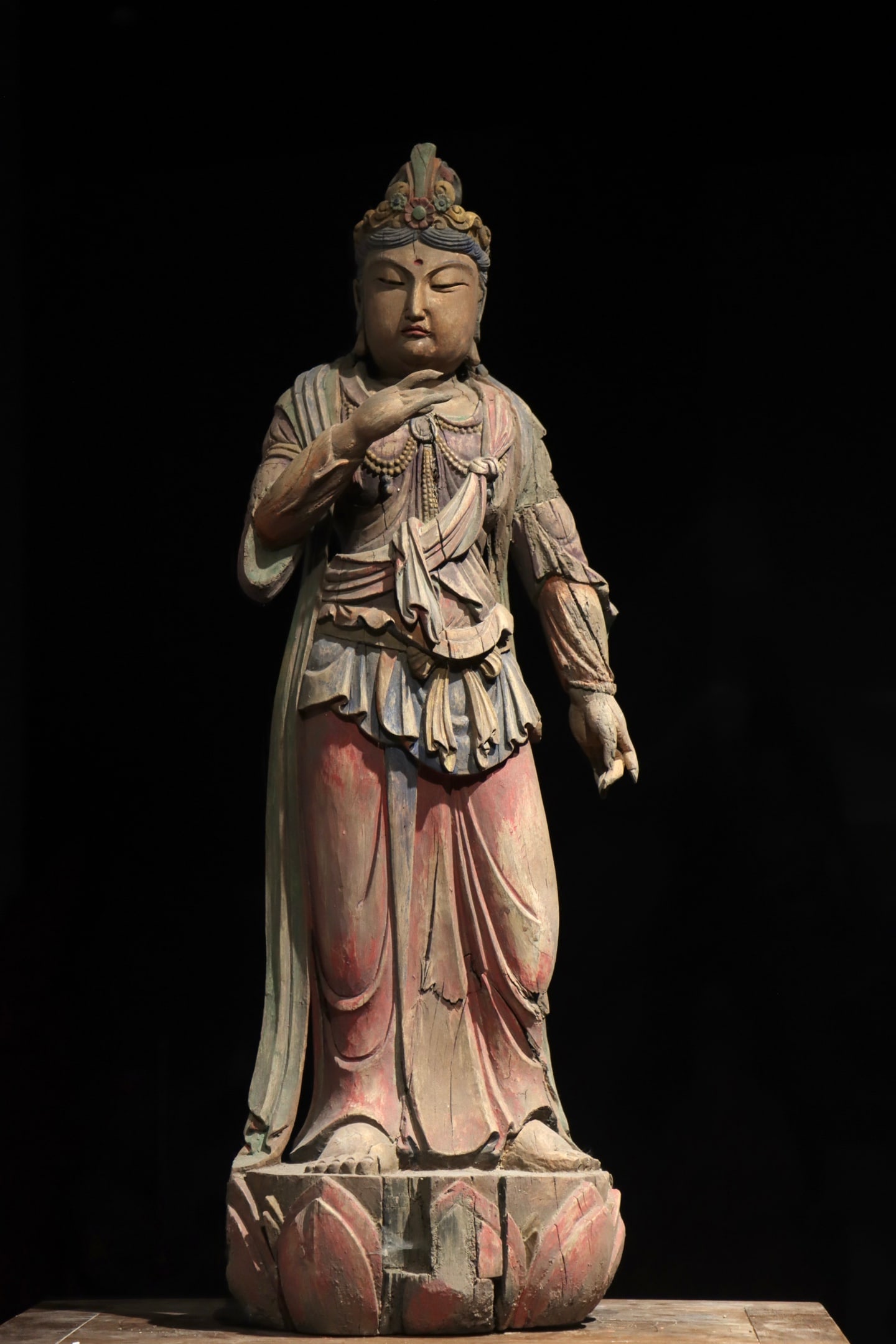 A standing statue of Guanyin Bodhisattva carved and painted in wood from the Song Dynasty: Height:86cm (33.86in)Wooden standing Guanyin Bodhisattva painted with mineral pigments, with flower crown and pearl necklaces, layered draped robes, lotus pedestal, traditional Chinese Buddhist sculpt