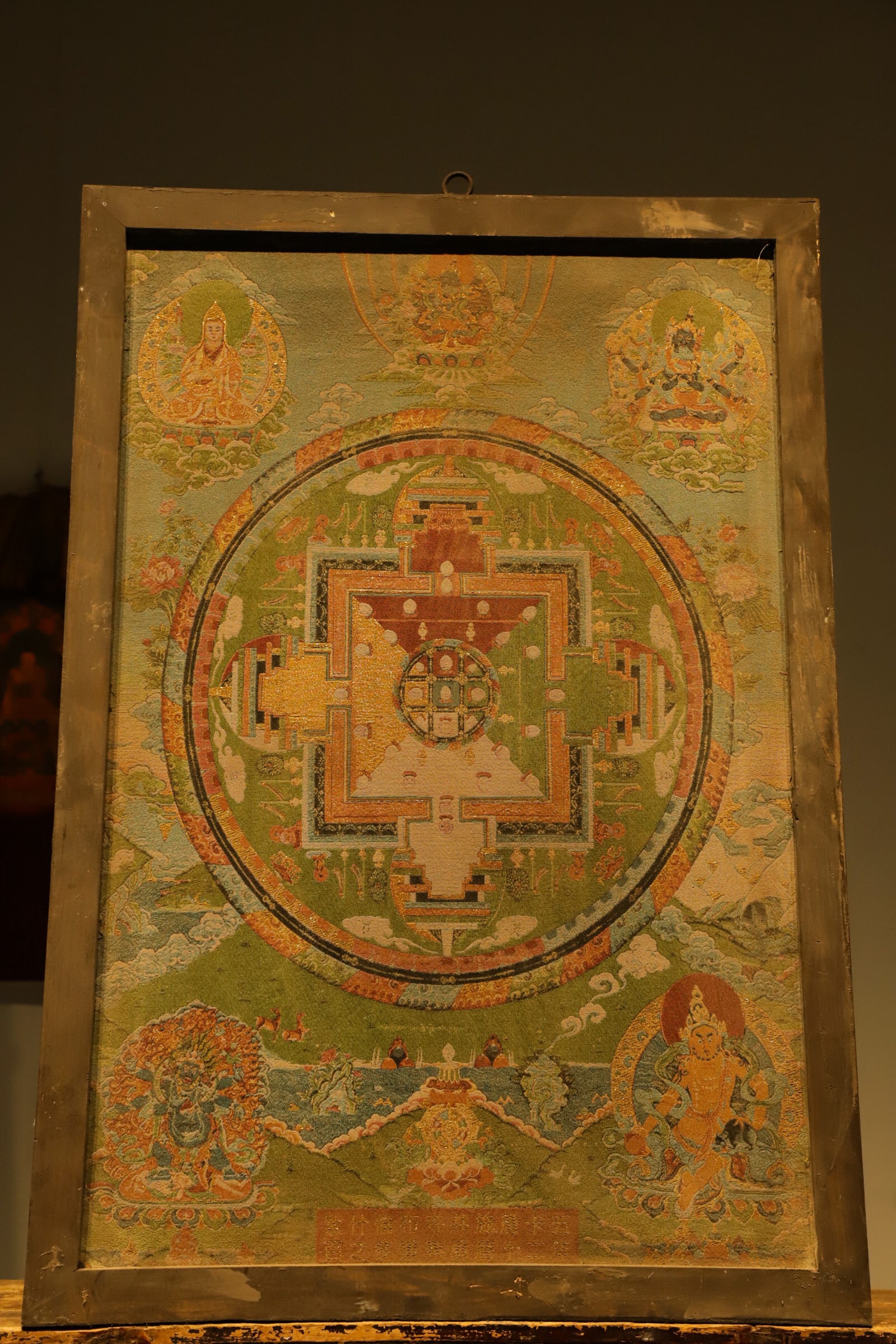 A fine mandala Thangka from the Qing Dynasty: Height:96cm(37.80in), Long:66cm(25.98in) Sino-Tibetan integrated thangka style of the Qing Dynasty, balanced rigorous composition, subtle muted color palette, delicate restrained gold thread work, sof