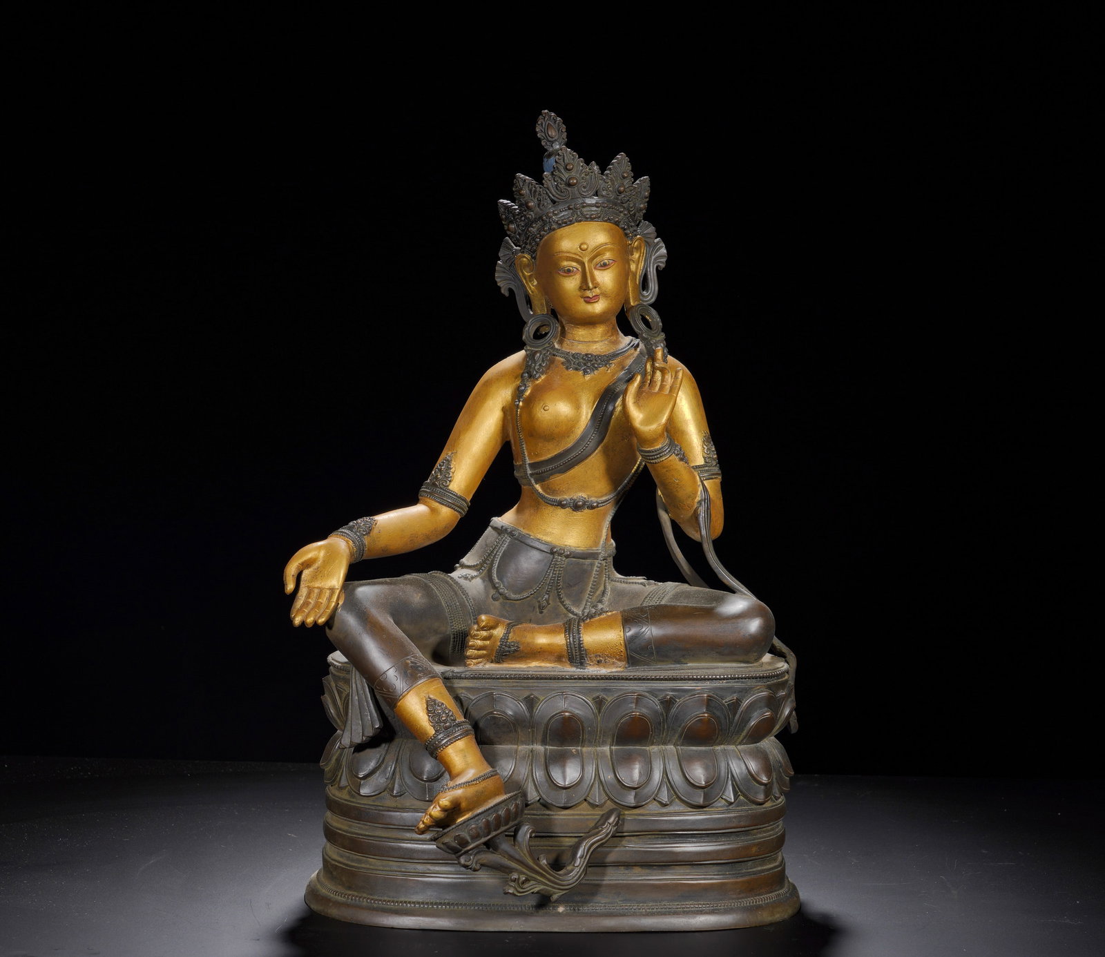 A gilded green Tara statue from the Qing Dynasty: Height:53cm(20.87in), Width:33cm(12.99in), Weight:10710g (23.612lb)Partially Gilt Bronze Seated Avalokiteshvara in LalitasanaMark: Bestowed in the Yongle Reign of the Great Ming DynastyCast from fine