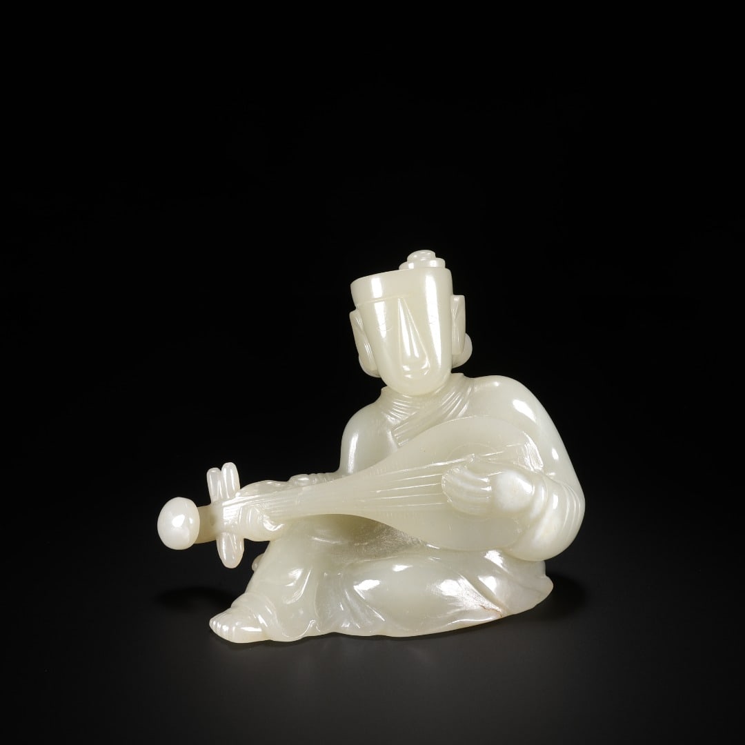 Han Hetian jade pipa handpiece: Long:4.9cm(1.93in), Width:4.6cm(1.81in), Height:8cm(3.15in), Weight:253g (0.558lb)Solid round carving from fine Hetian white jade with mild texture and soft patina. The musician sits cross-legged, hol