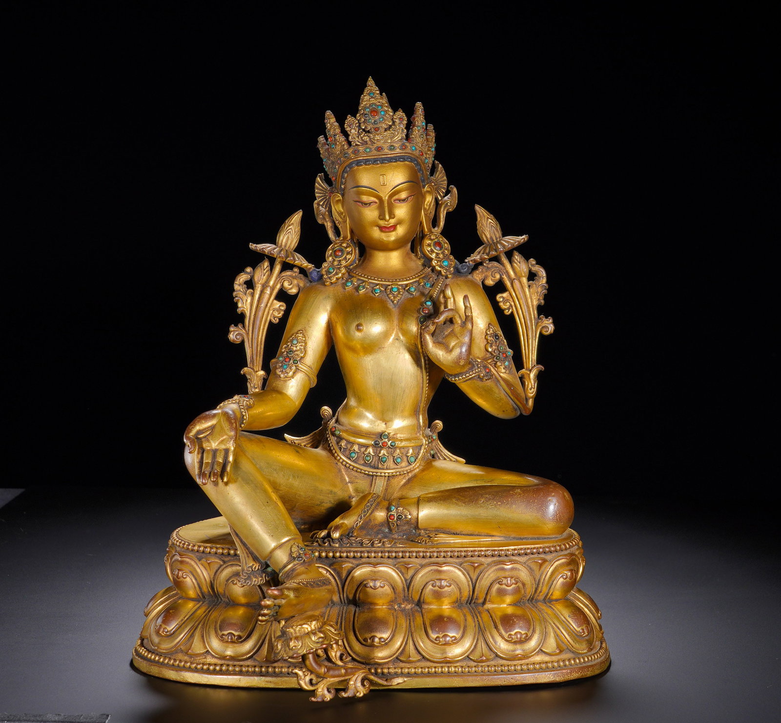 Qing Dynasty Qianlong gilded Bronze Statue of the Emerald Green Tara: Height:31cm(12.20in), Width:25cm(9.84in), Weight:4490g (9.899lb)This is a gilt-bronze seated statue of Green Tara of the Qianlong reign of the Qing Dynasty, inscribed along the base rim: Offered on