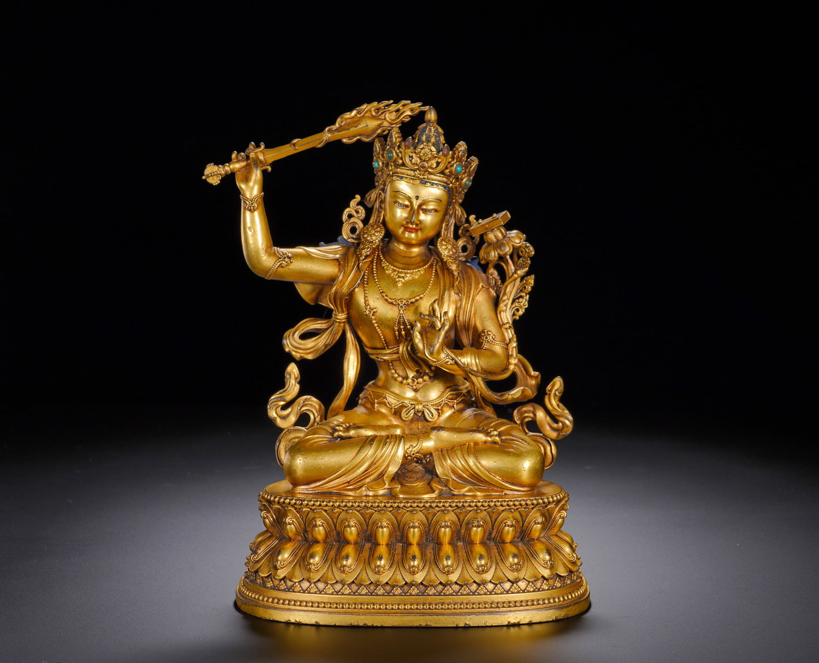 Gilded bronze Manjusri Bodhisattva statues from the Ming Dynasty: Height:20cm(7.87in), Width:14.5cm(5.71in), Weight:1270g (2.799lb)This is a gilt-bronze seated statue of Manjushri Bodhisattva, inscribed with “Bestowed in the Yongle Reign of the Great Ming Dynasty&