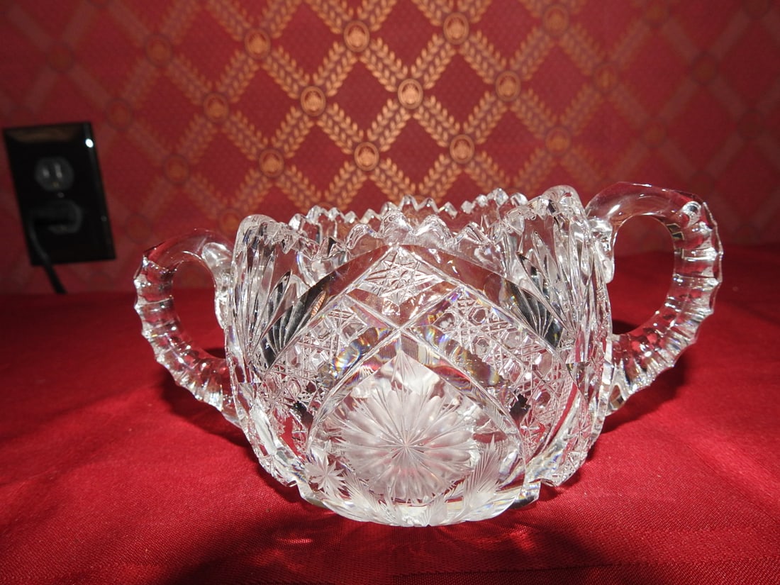 ABP Cut Crystal Double-Handled Bonbon Bowl: Small American Brilliant Period style hand-cut crystal double-handled bonbon or centerpiece bowl with strawberry diamond and hobstar cutting. Approx. 3 x 4 x 4 in. Unmarked unless otherwise noted; mak