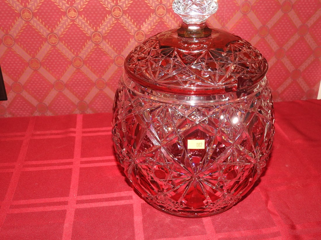 Ruby Flash Cut-to-Clear Covered Candy Jar: Large ruby flash cut-to-clear covered candy jar or biscuit barrel with lid and geometric cut decoration. Approx. 14 x 8.5 x 8.5 in. Unmarked unless otherwise noted; maker/pattern attribution is based