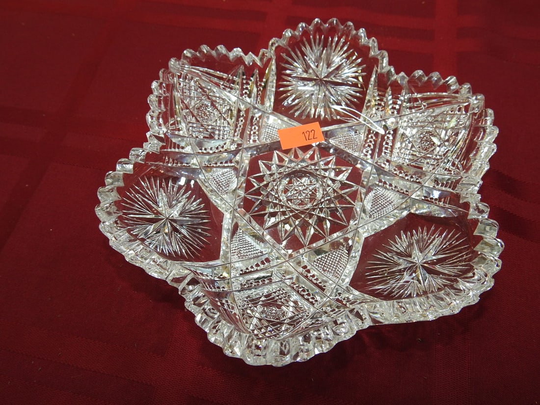 Cut Glass Oval Serving / Celery Bowl: Cut glass oval serving or celery bowl with scalloped rim, hobstar/fan panels and geometric cut decoration. Approx. 1.25 x 6 x 6 in. Unmarked unless otherwise noted; maker/pattern attribution is based