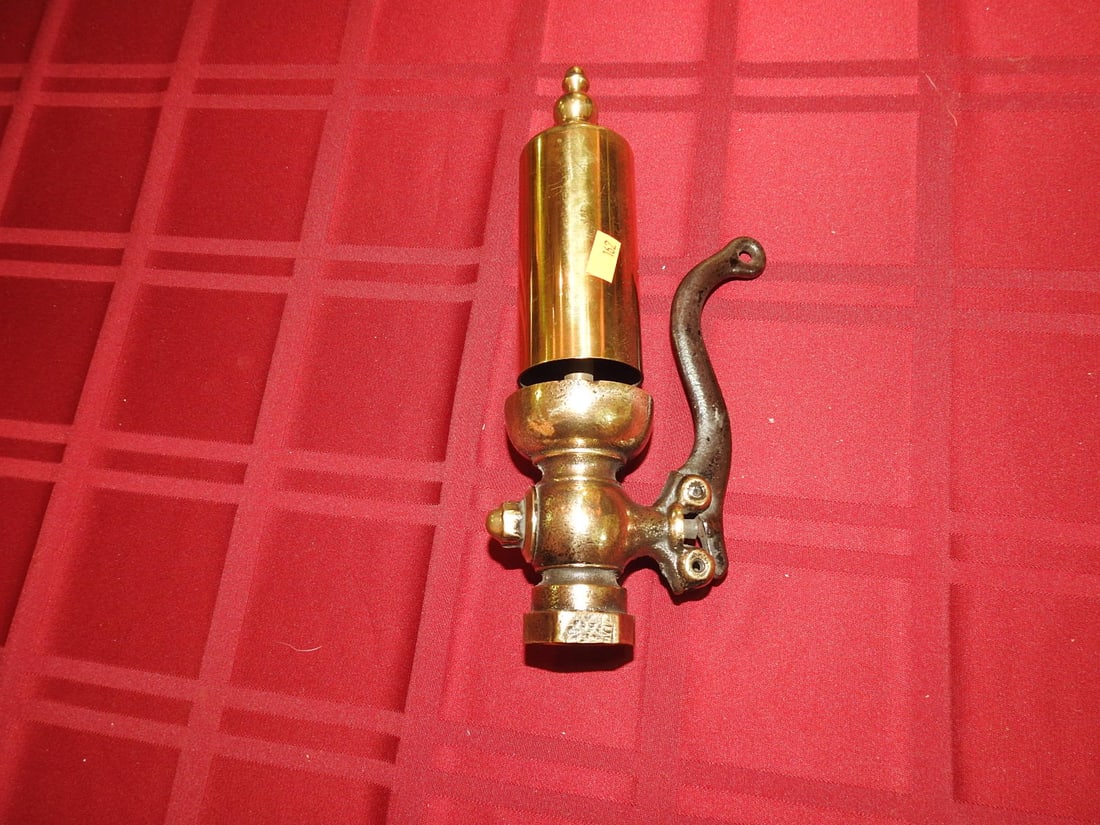 Brass Steam Whistle with Valve: Vintage brass steam whistle with attached valve/lever assembly and threaded fitting. Approx. 10 x 3.75 x 2.25 in. Function not tested. Shows age-related wear, patina, finish wear, oxidation, surface s