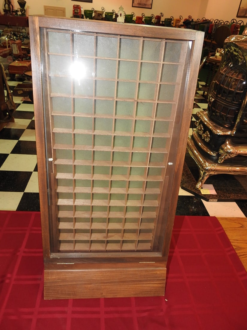 Wooden Display Case with 84 Compartments: Vintage wooden display case or collector cabinet with glass front and 84 small square compartments, each approximately 2 x 2 in. Approx. 30 x 15 x 12 in. Shows finish wear, scratches, scuffs and
