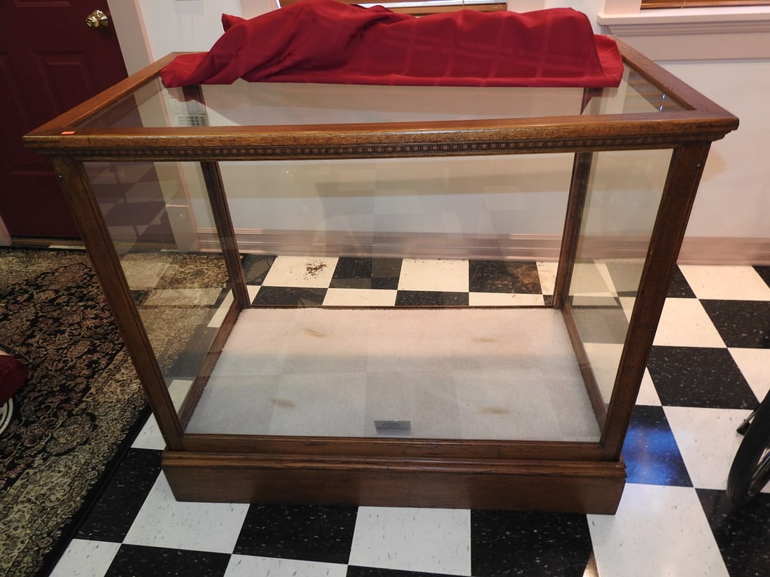 Vintage Glass Display Case: Vintage display case with glass enclosure and lower cabinet/base form. Approx. 42 x 48 x 28 in. Shows age/use wear, finish marks, scratches, glass wear, hardware wear and patina; see photos for condit